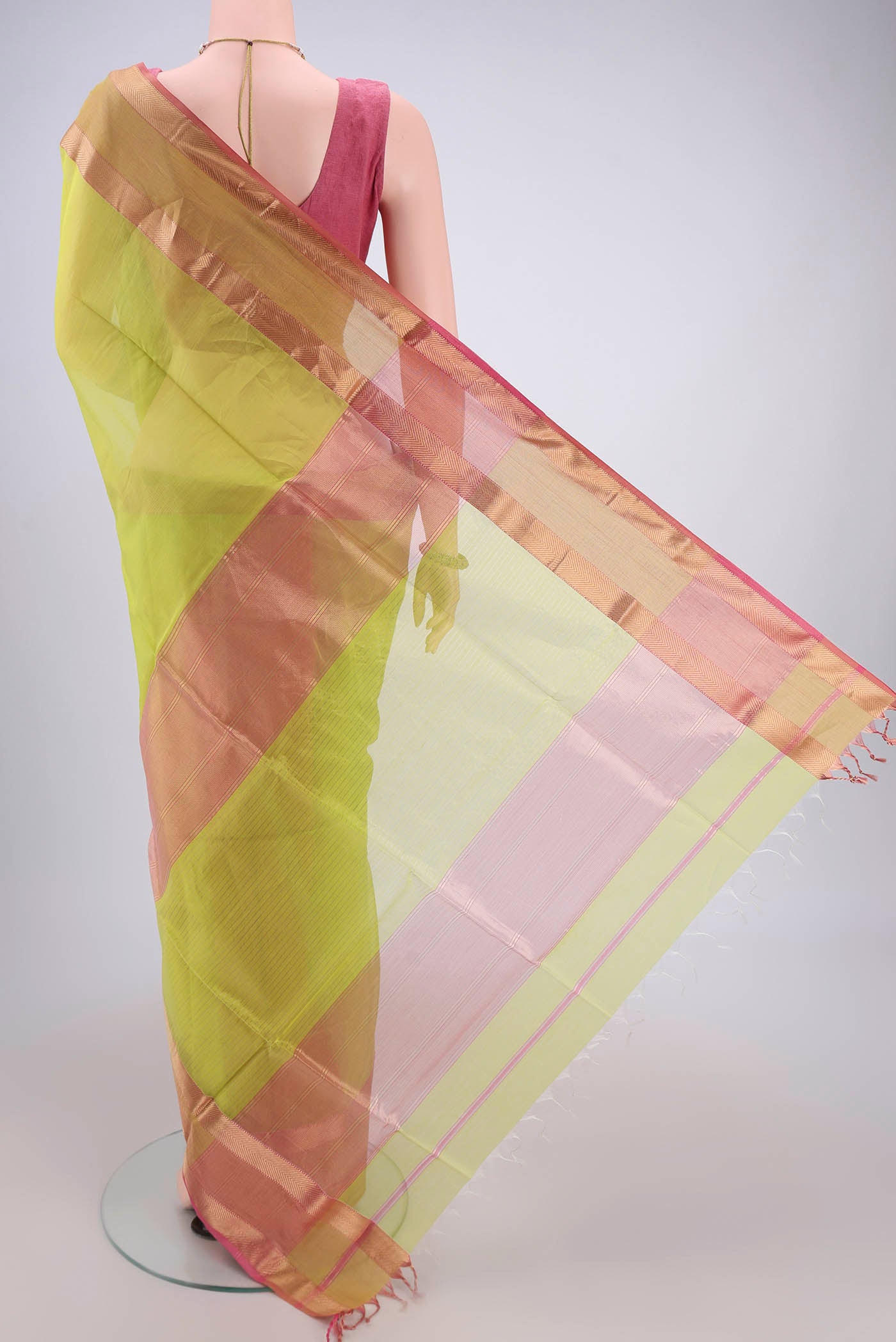 Flat view of Parrot Green Maheshwari Silk Cotton Saree with Plain Body and Zari Border. 