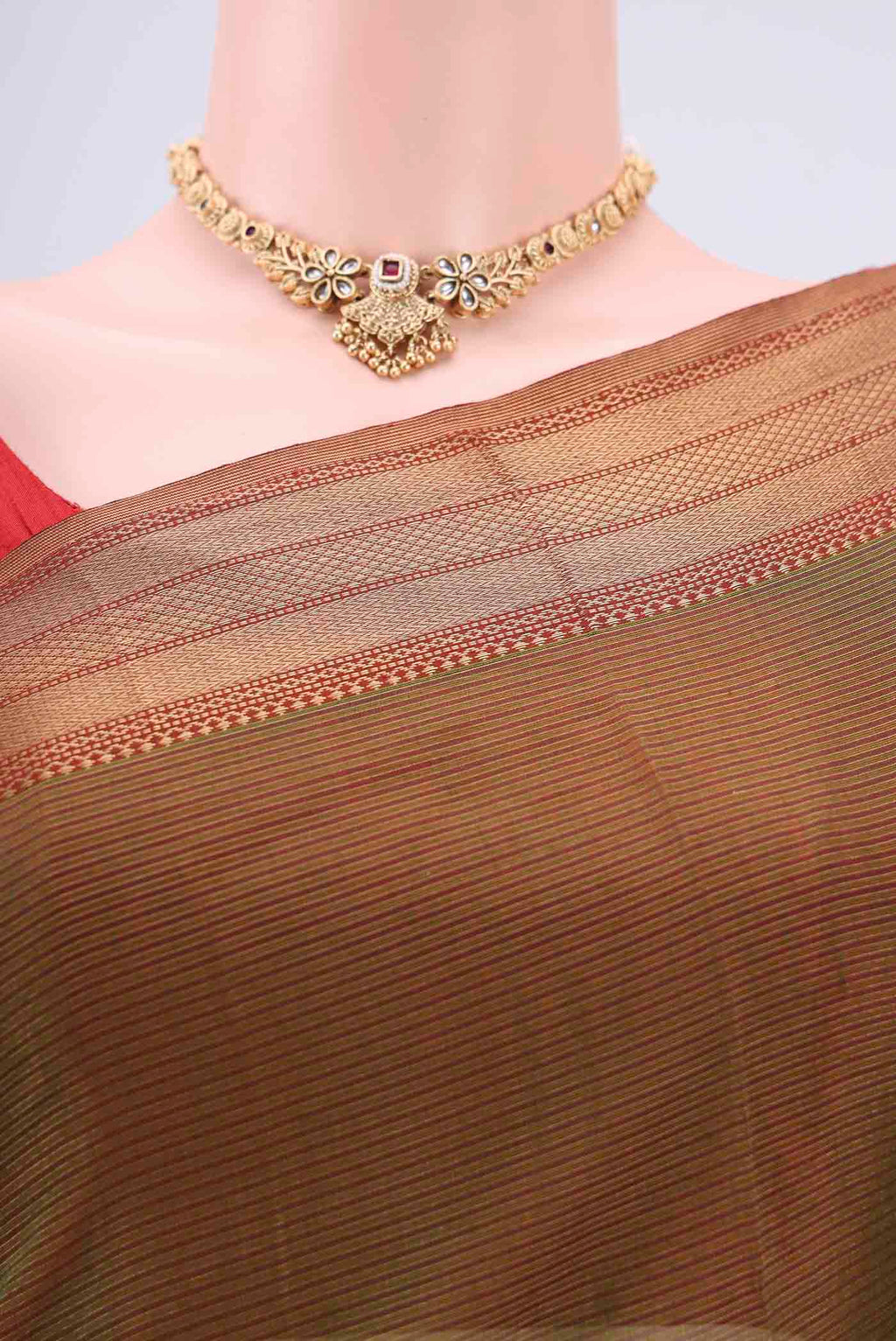 Border image of Mehandi Green Maheshwari Silk Cotton Saree with Stripes on the body and Zari Border. 