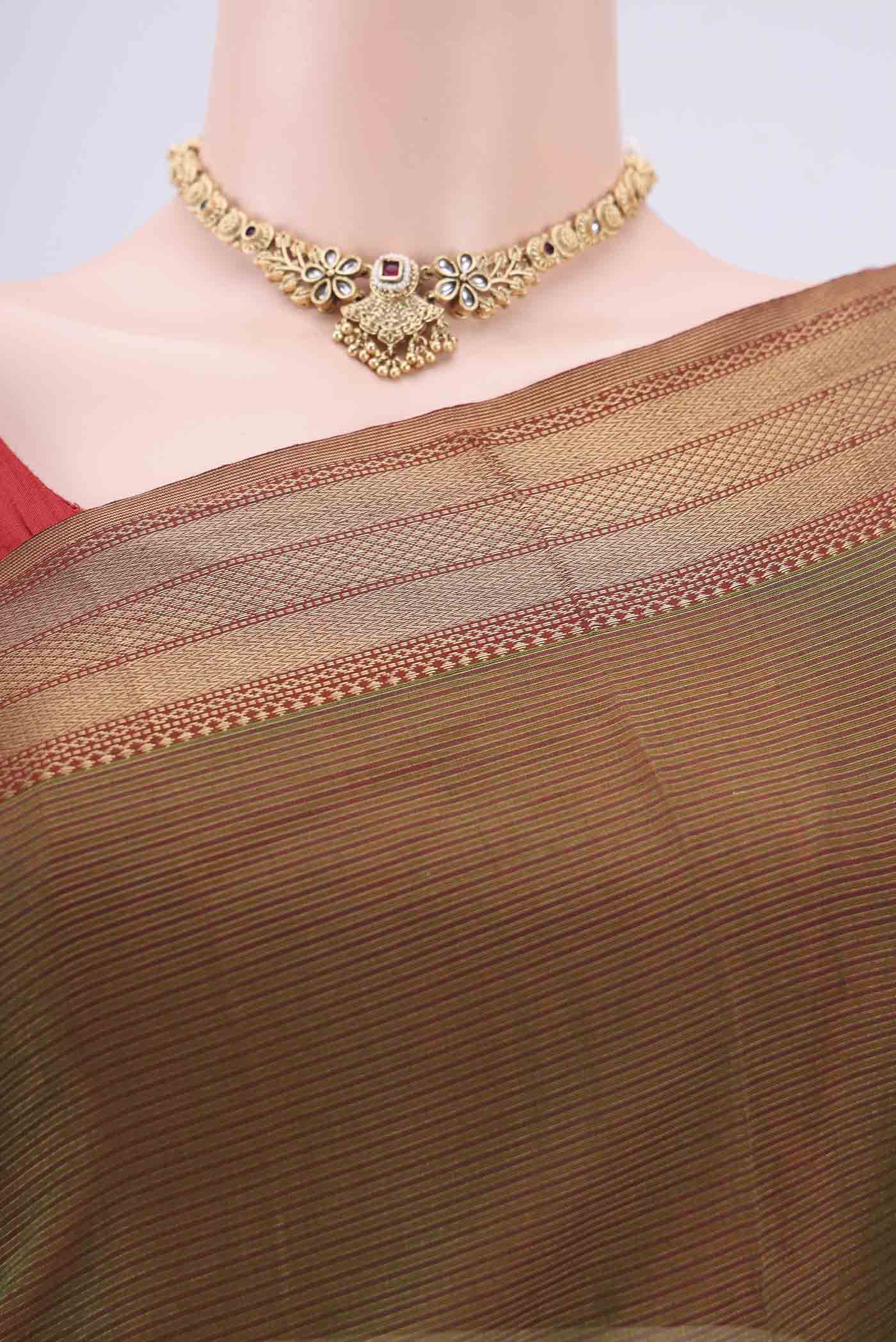 Border image of Mehandi Green Maheshwari Silk Cotton Saree with Stripes on the body and Zari Border. 