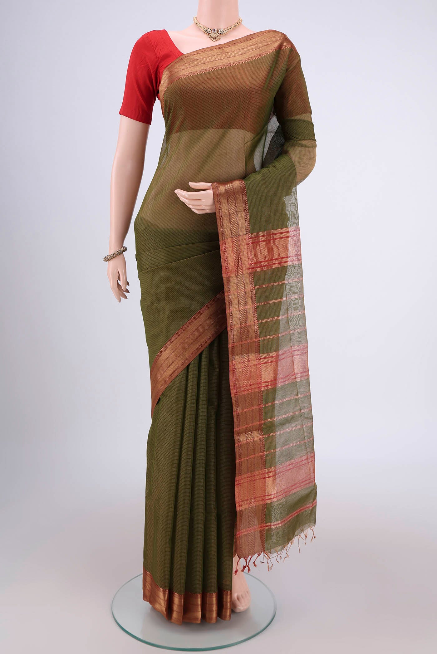 Mehandi Green Maheshwari Silk Cotton Saree with Stripes on the body and Zari Border.  displayed on a mannequin