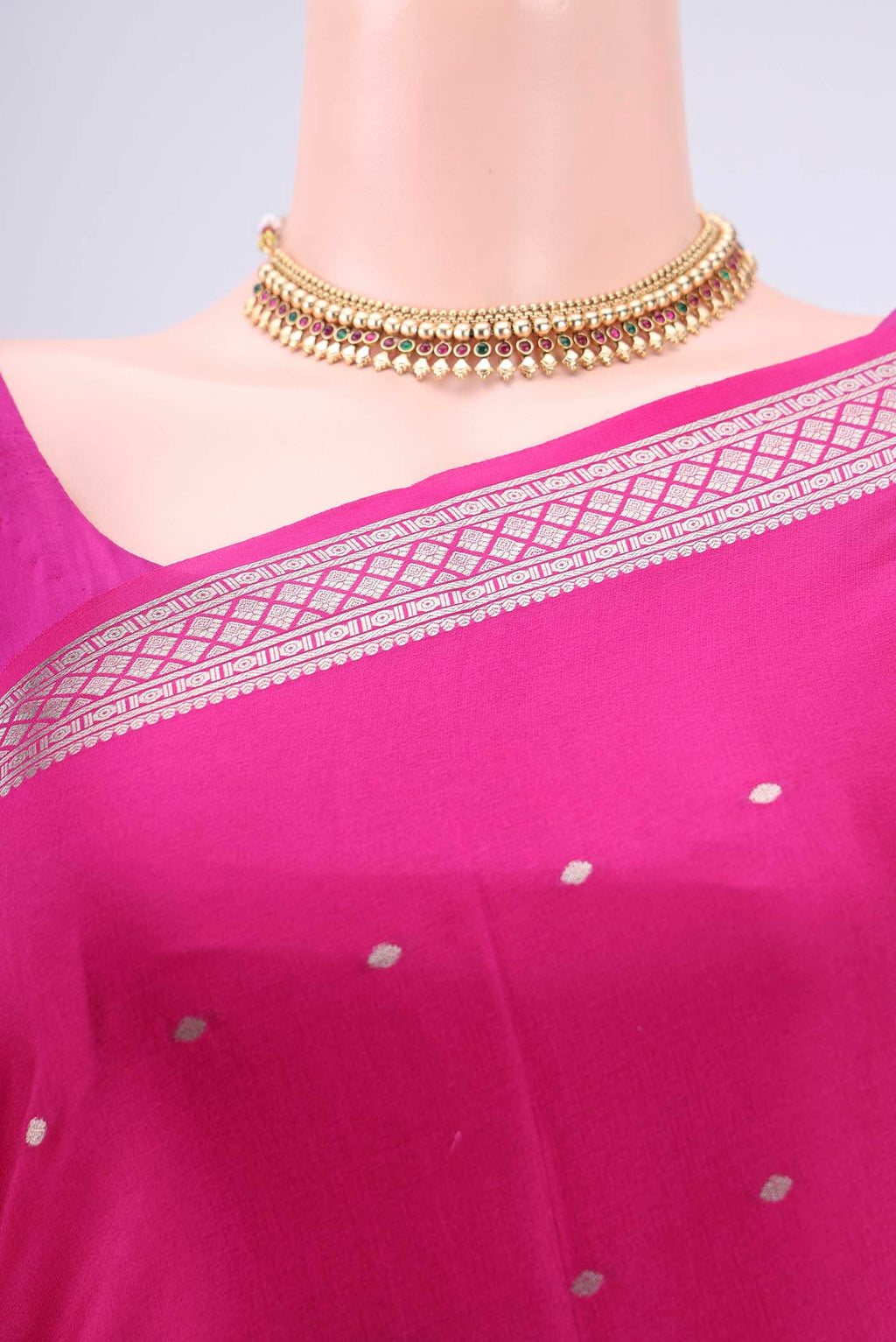 Border image of Rani Pink Mysore Crepe Saree with Zari Butta on the body and Zari Border. 