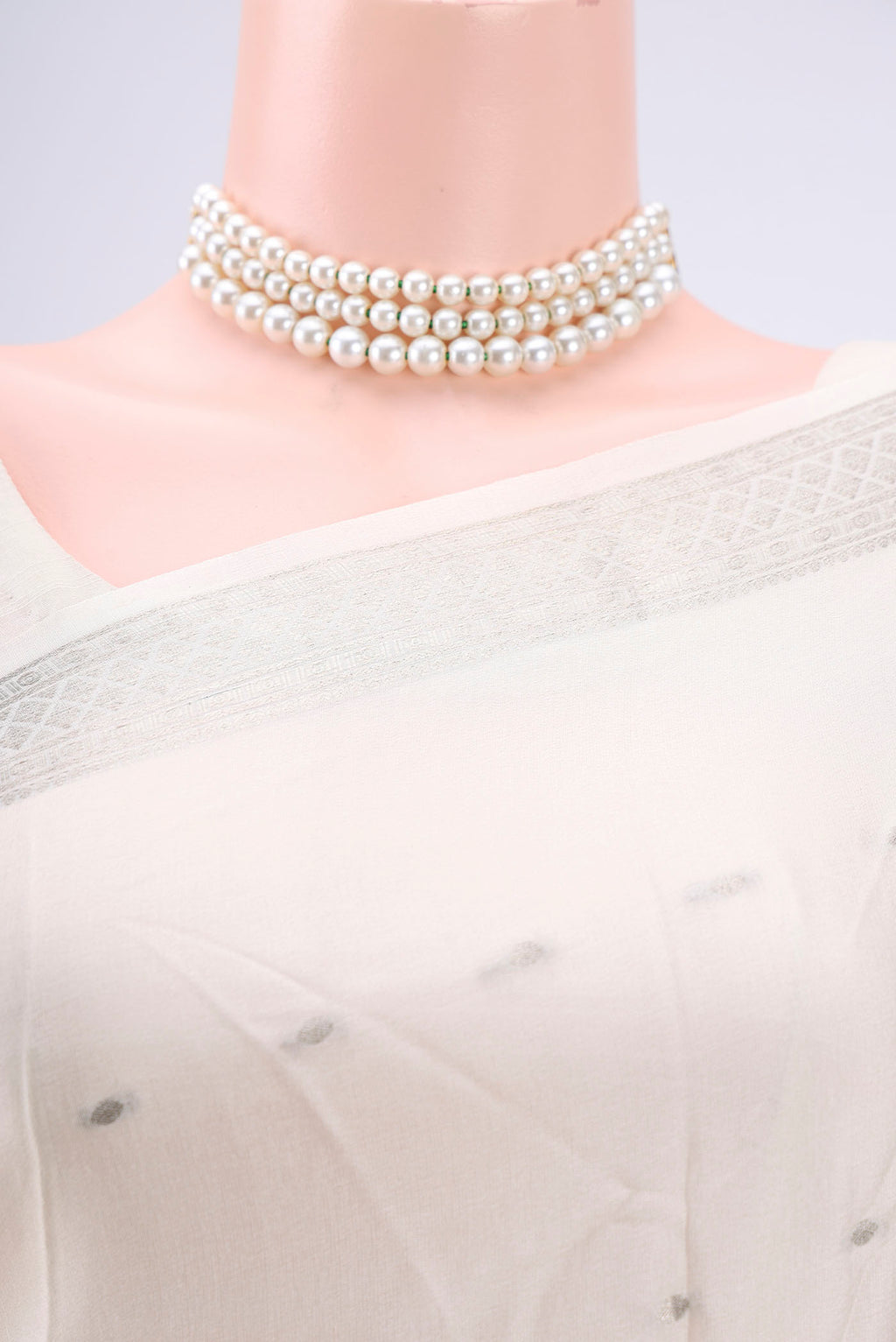 Border image of White Mysore Crepe Saree with Zari Butta on the body and Zari Border. 