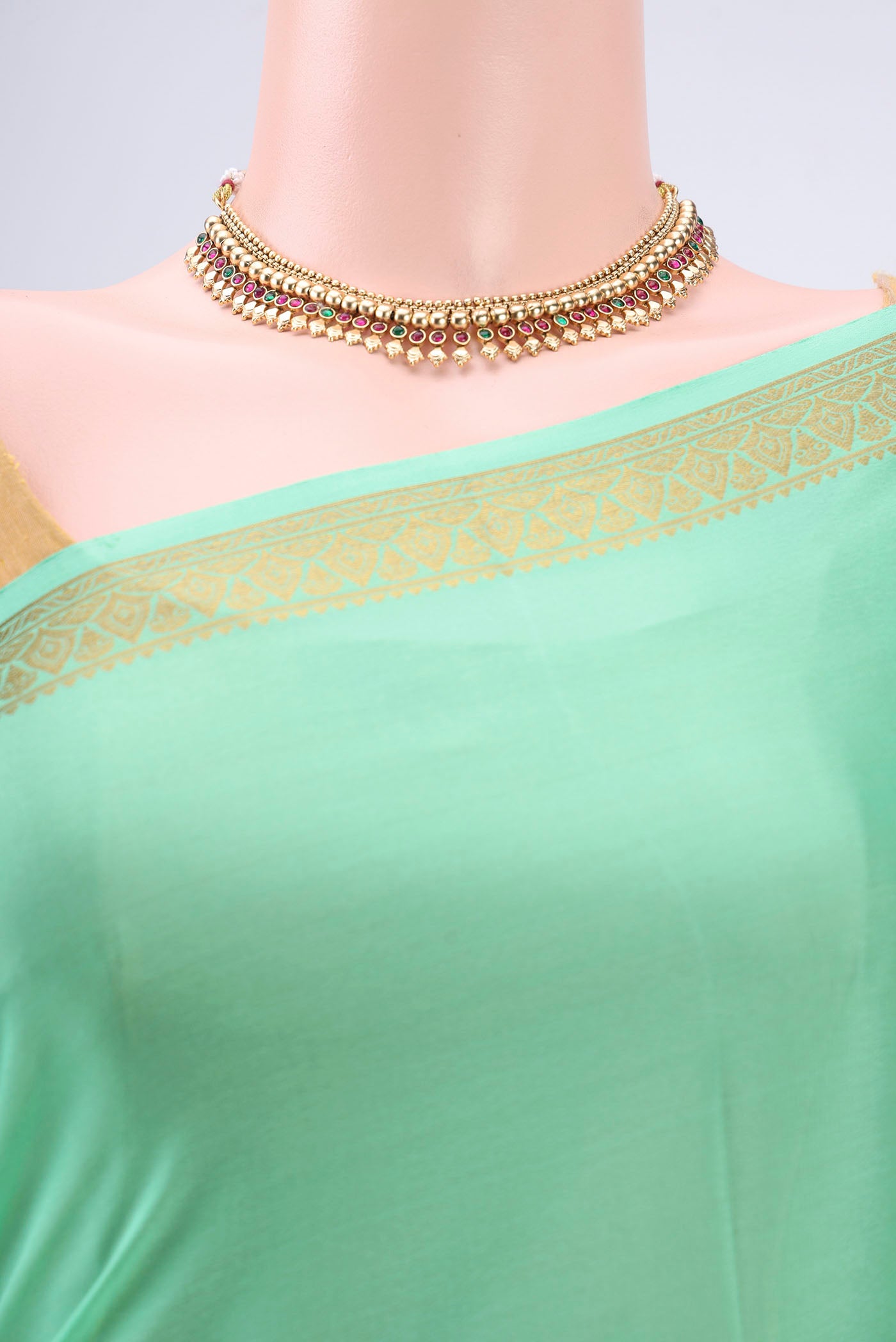 Border image of Mint Green Mysore Crepe Saree with Plain Body and Zari Border. 