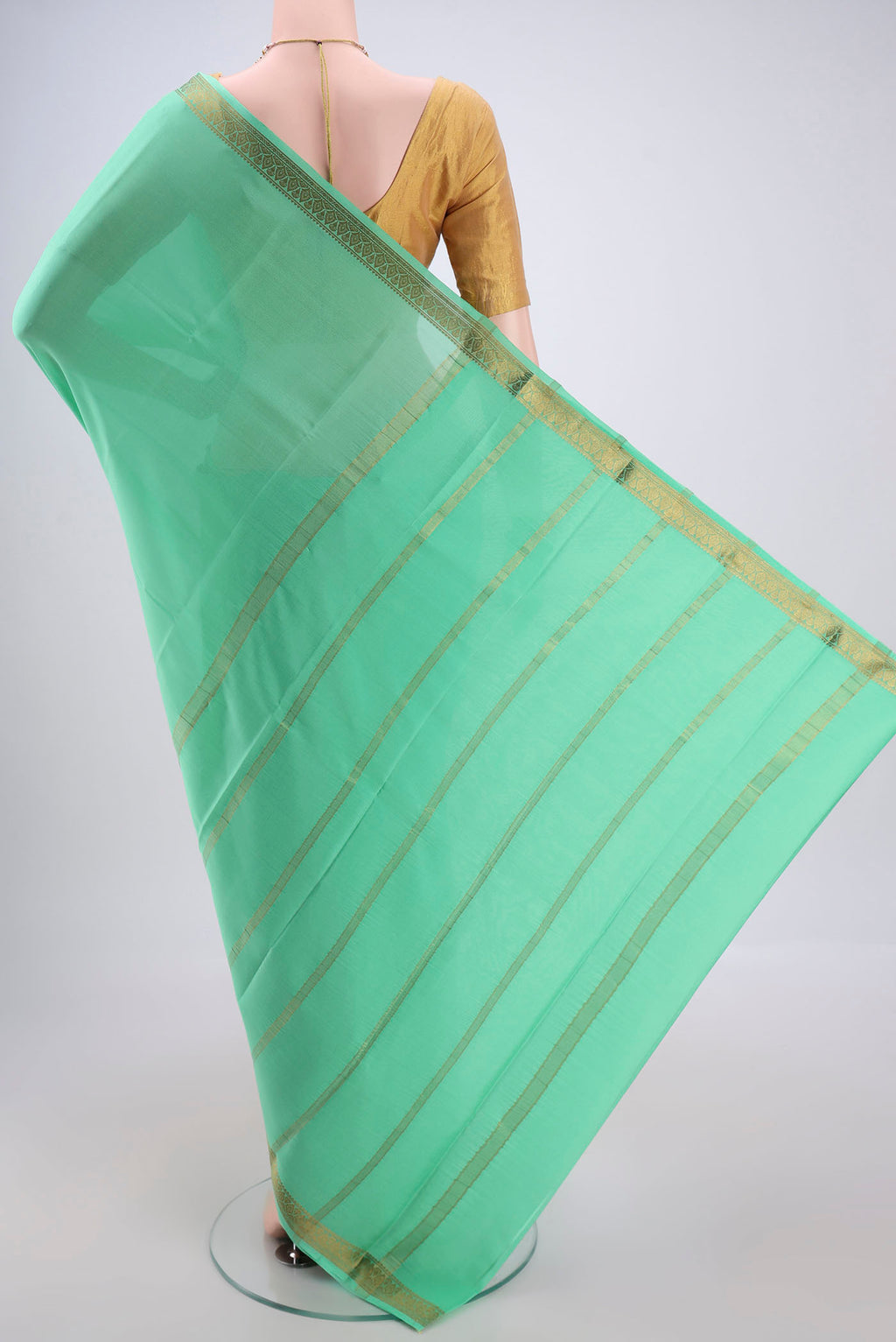 Flat view of Mint Green Mysore Crepe Saree with Plain Body and Zari Border. 