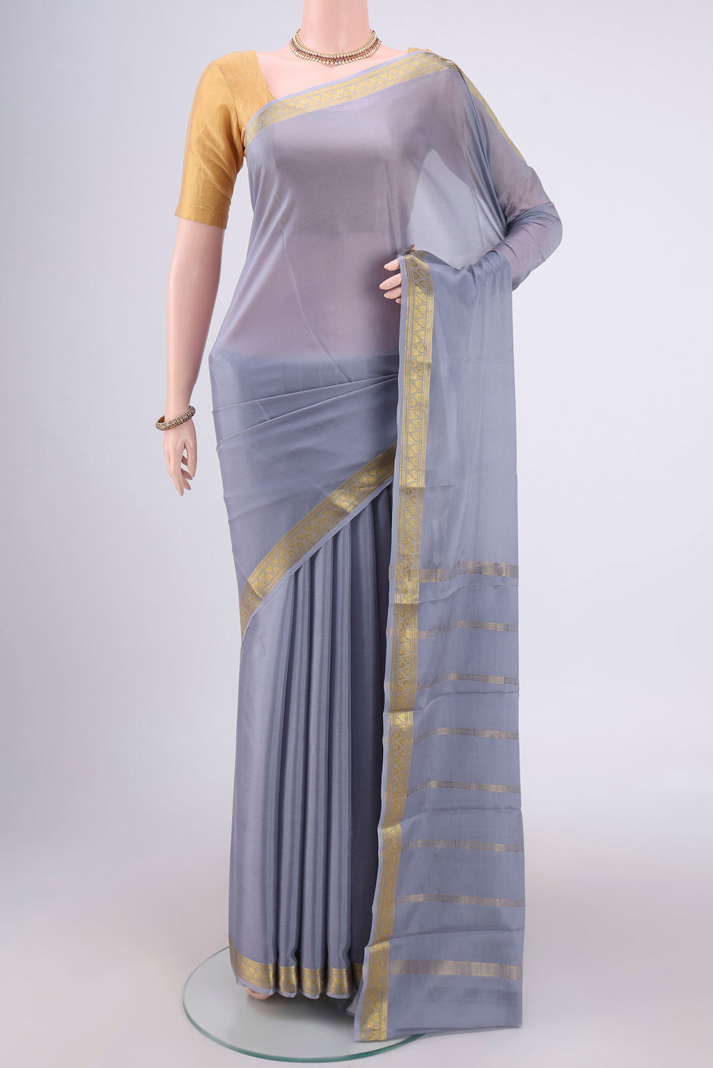 Blue Grey Mysore Crepe Saree with Plain Body and Zari Border.  displayed on a mannequin