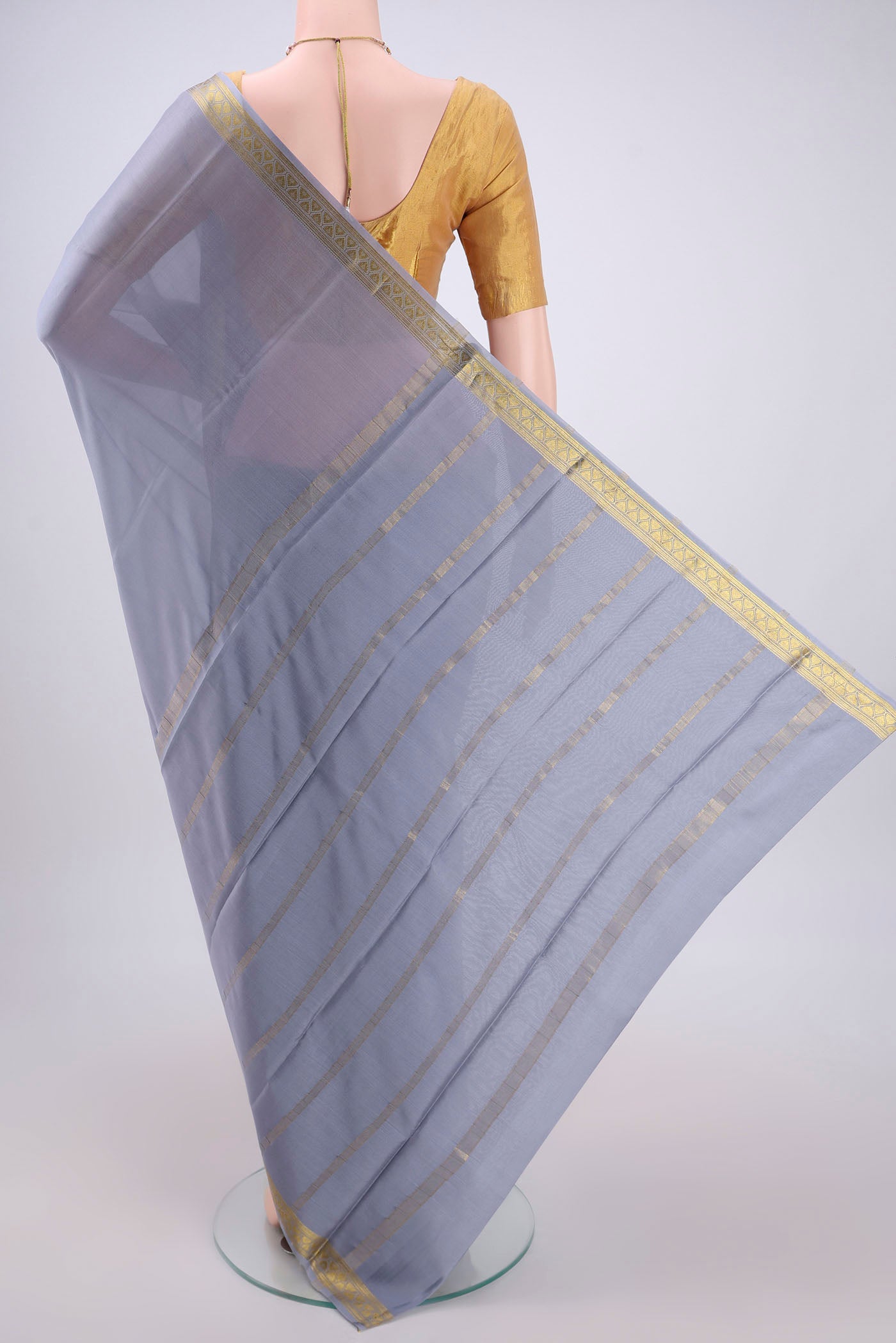 Flat view of Blue Grey Mysore Crepe Saree with Plain Body and Zari Border. 