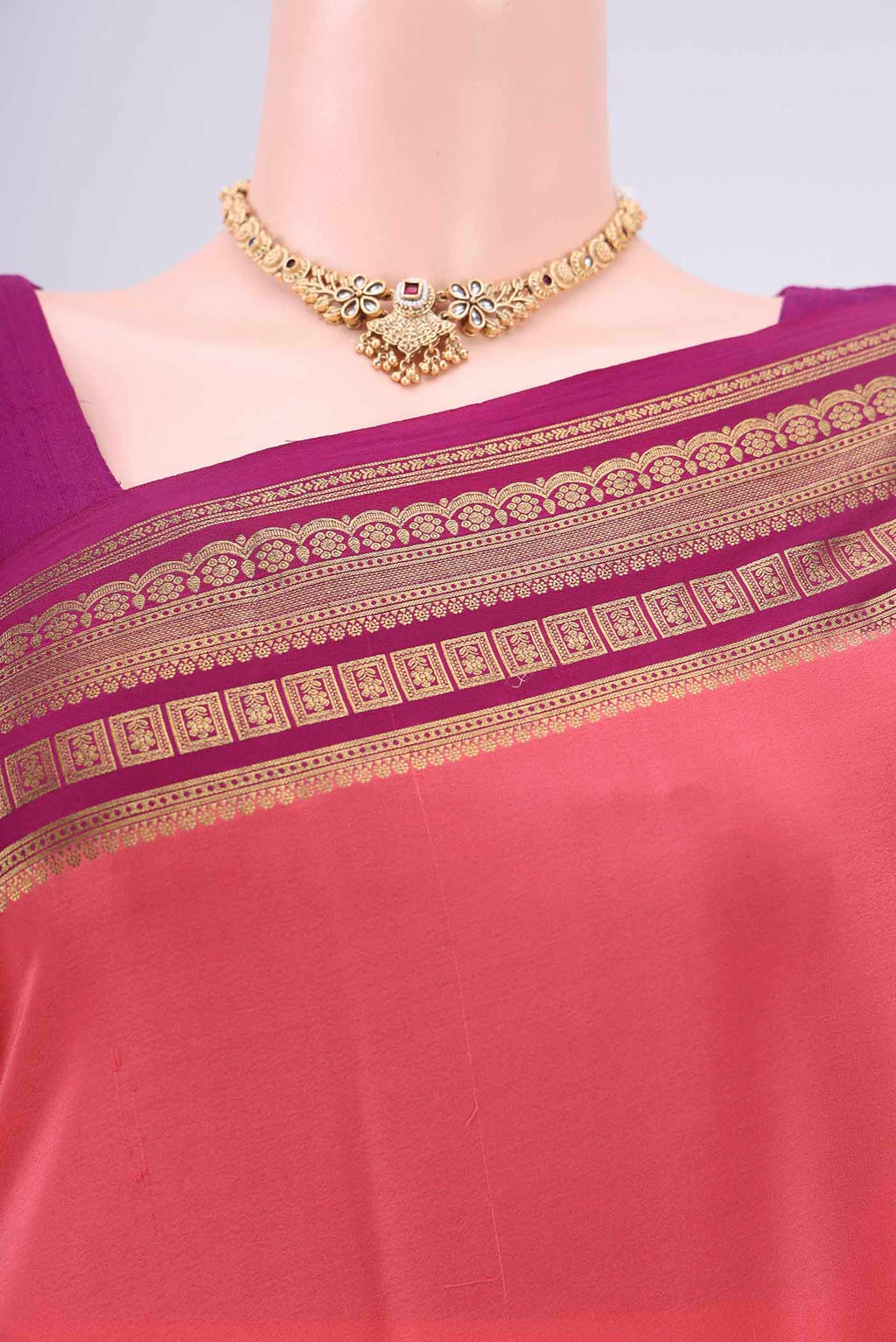Border image of Peach Mysore Crepe Saree with Plain Body and Zari Border. 