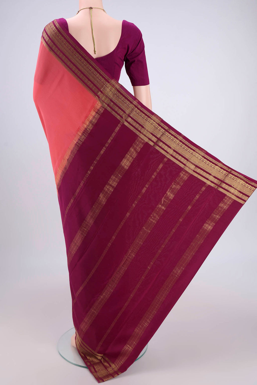 Flat view of Peach Mysore Crepe Saree with Plain Body and Zari Border. 