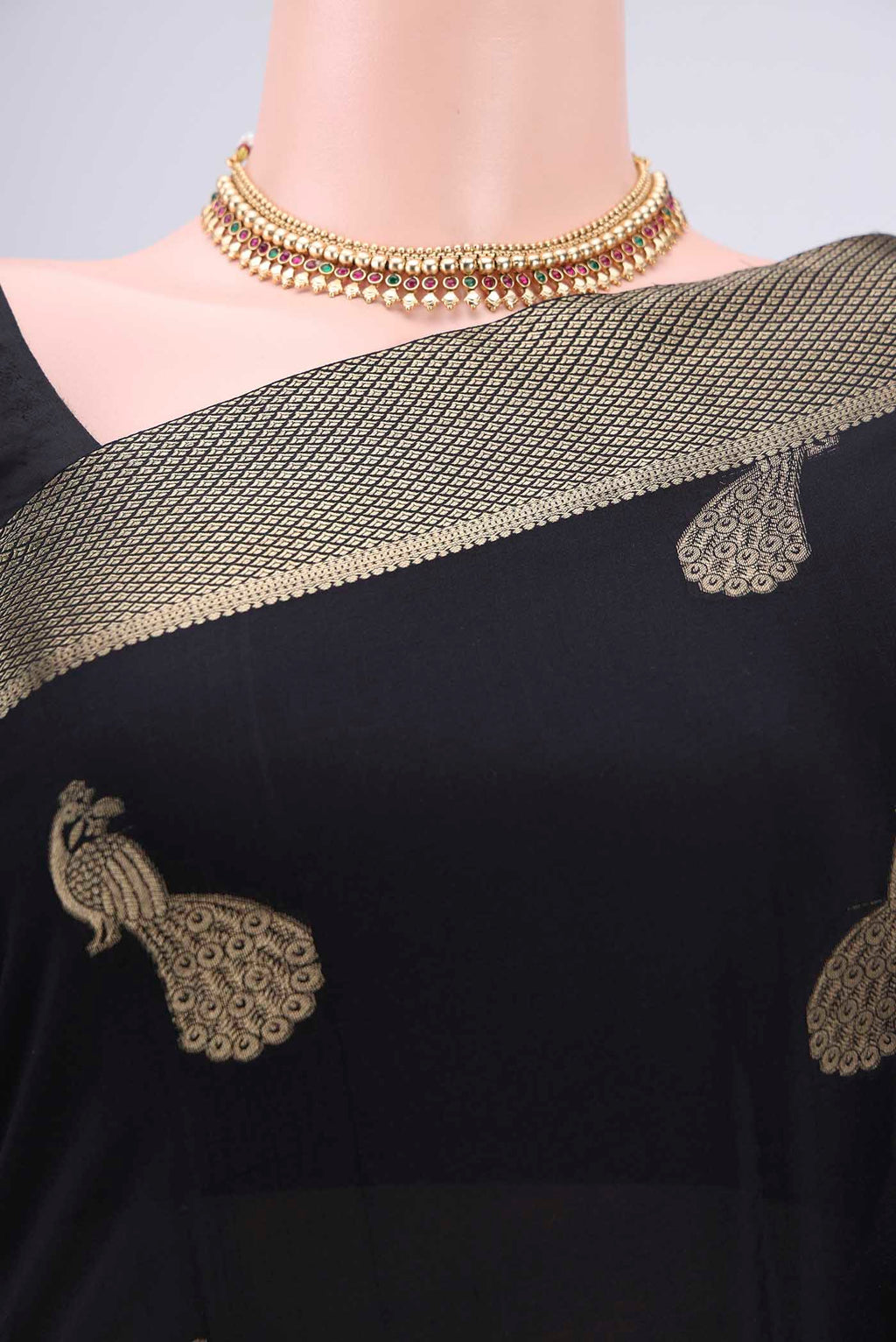 Border image of Black Mysore Crepe Saree with Zari Butta on the body and Zari Border. 