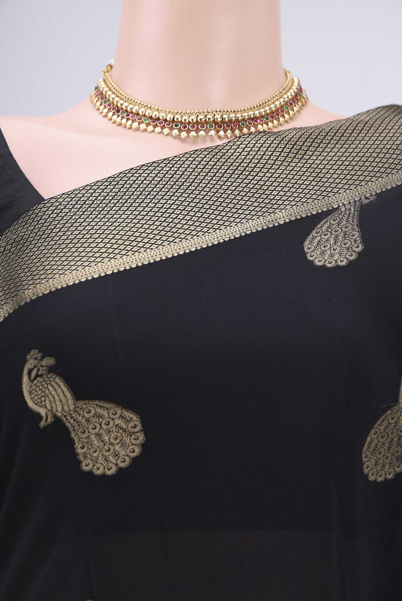 Border image of Black Mysore Crepe Saree with Zari Butta on the body and Zari Border. 