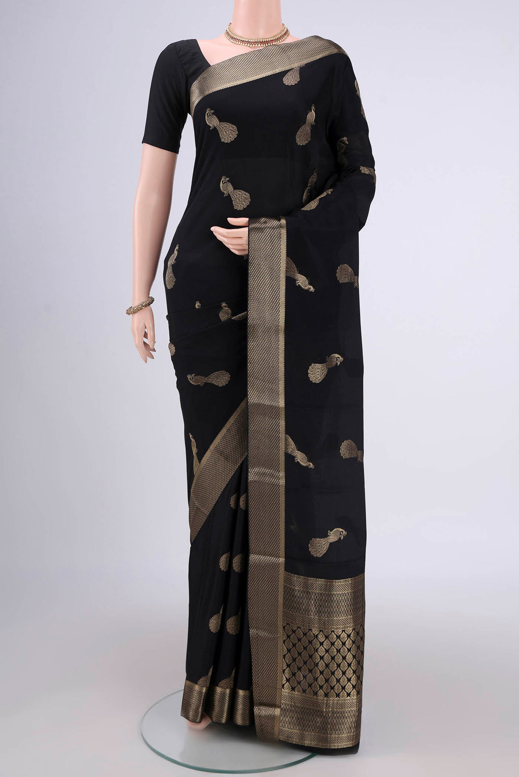 Black Mysore Crepe Saree with Zari Butta on the body and Zari Border.  displayed on a mannequin