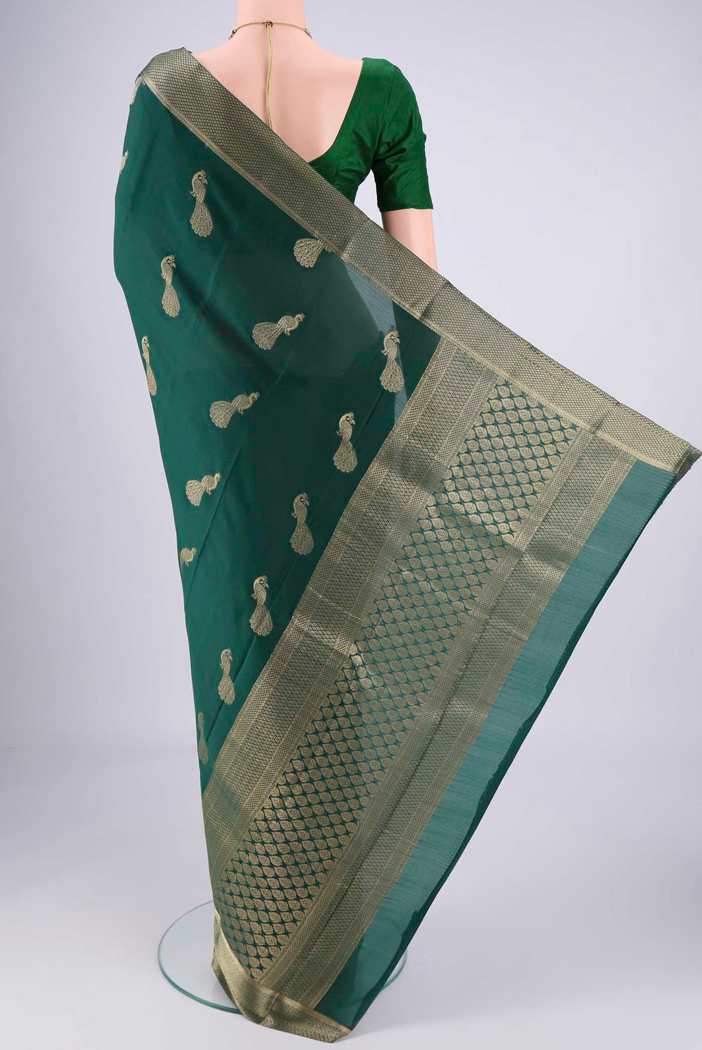Flat view of Bottle Green Mysore Crepe Saree with Plain Body and Zari Border. 
