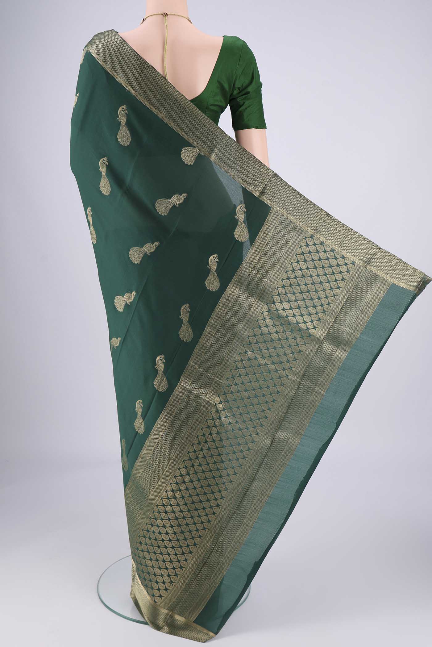 Flat view of Bottle Green Mysore Crepe Saree with Plain Body and Zari Border. 