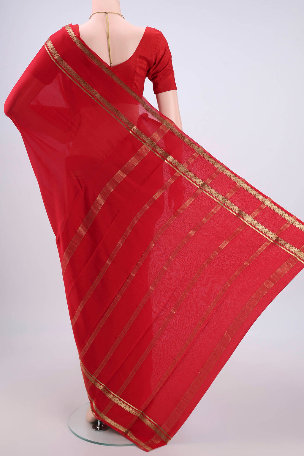 Flat view of Red Mysore Crepe Saree with Plain Body and Zari Border. 