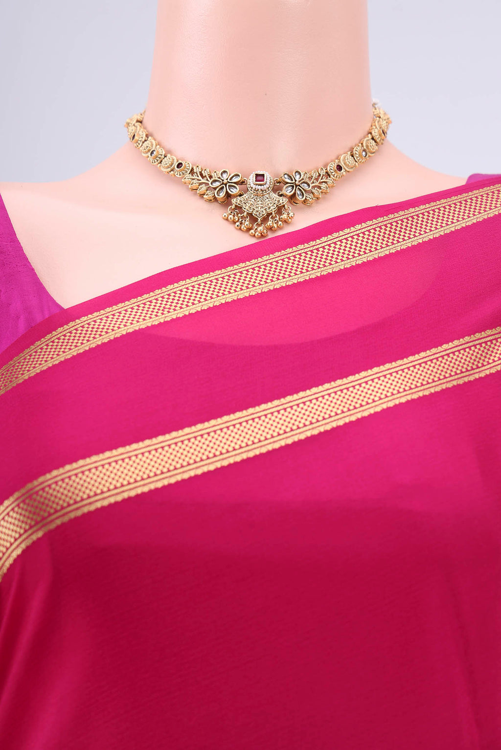 Border image of Rani Pink Mysore Crepe Saree with Plain Body and Zari Border. 