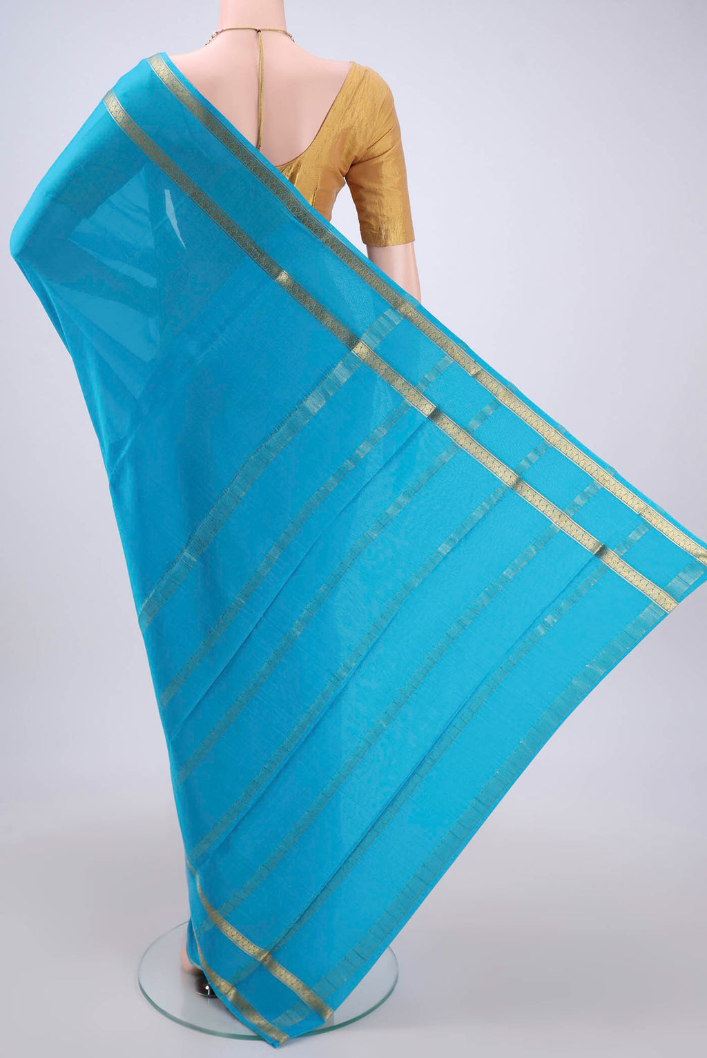Flat view of Blue Mysore Crepe Saree with Plain Body and Zari Border. 