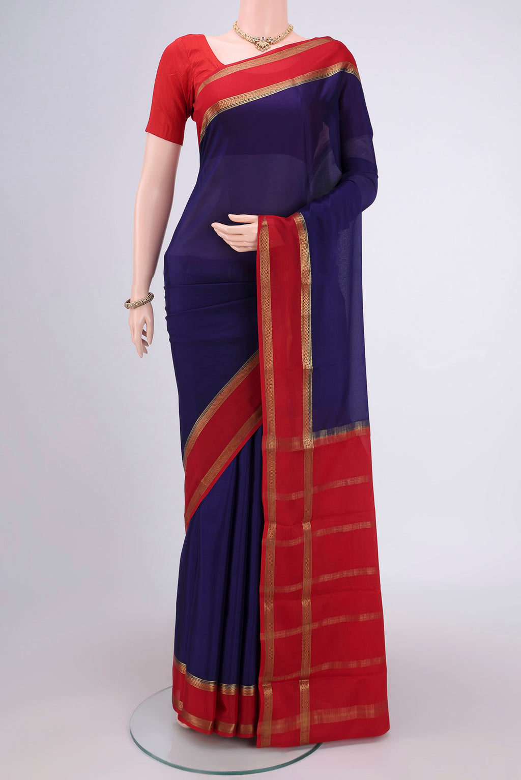 Navy Blue Mysore Crepe Saree with Plain Body and Zari Border.  displayed on a mannequin