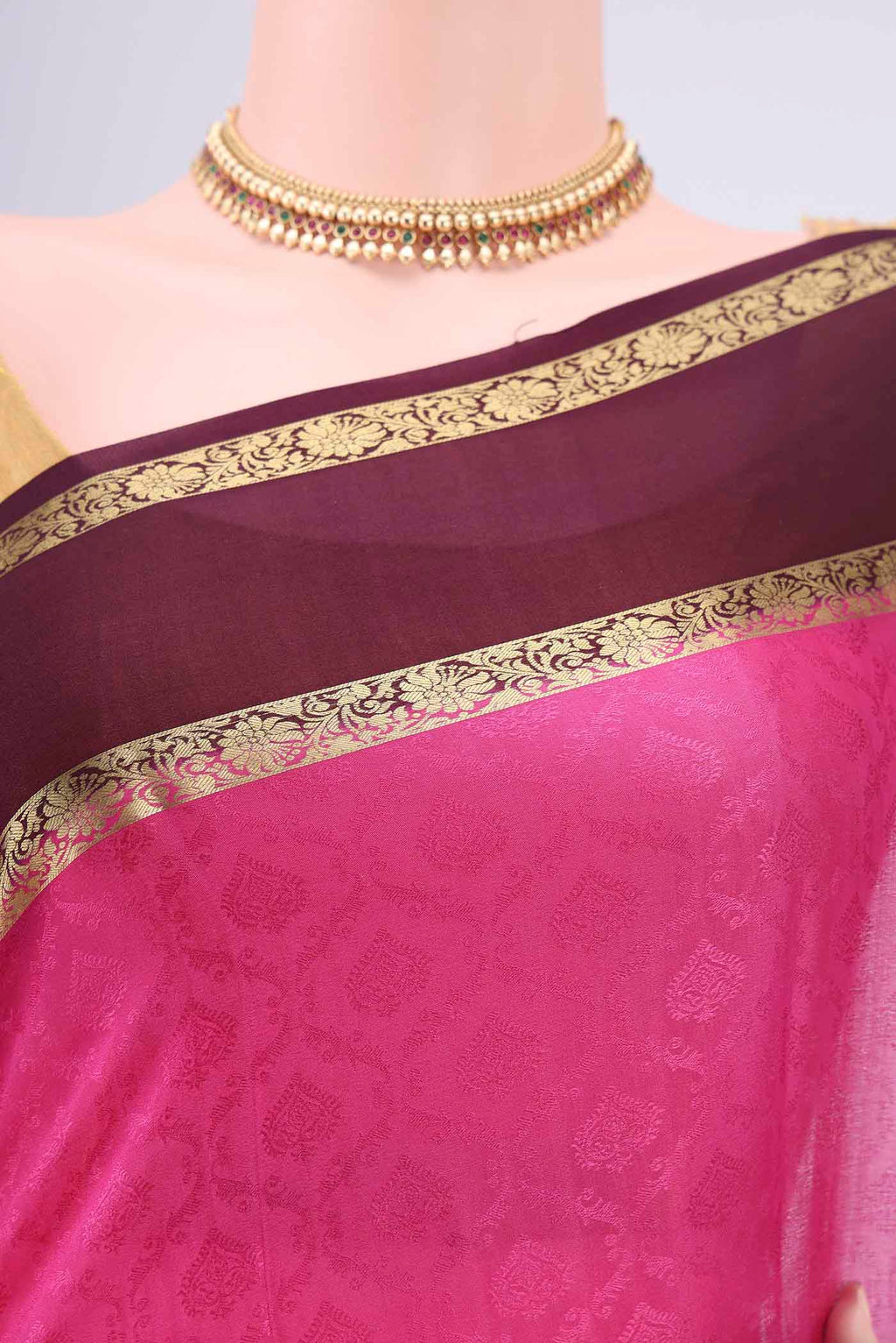 Border image of Rani Pink Mysore Crepe Saree with Jacquard design on the body and Zari Border. 