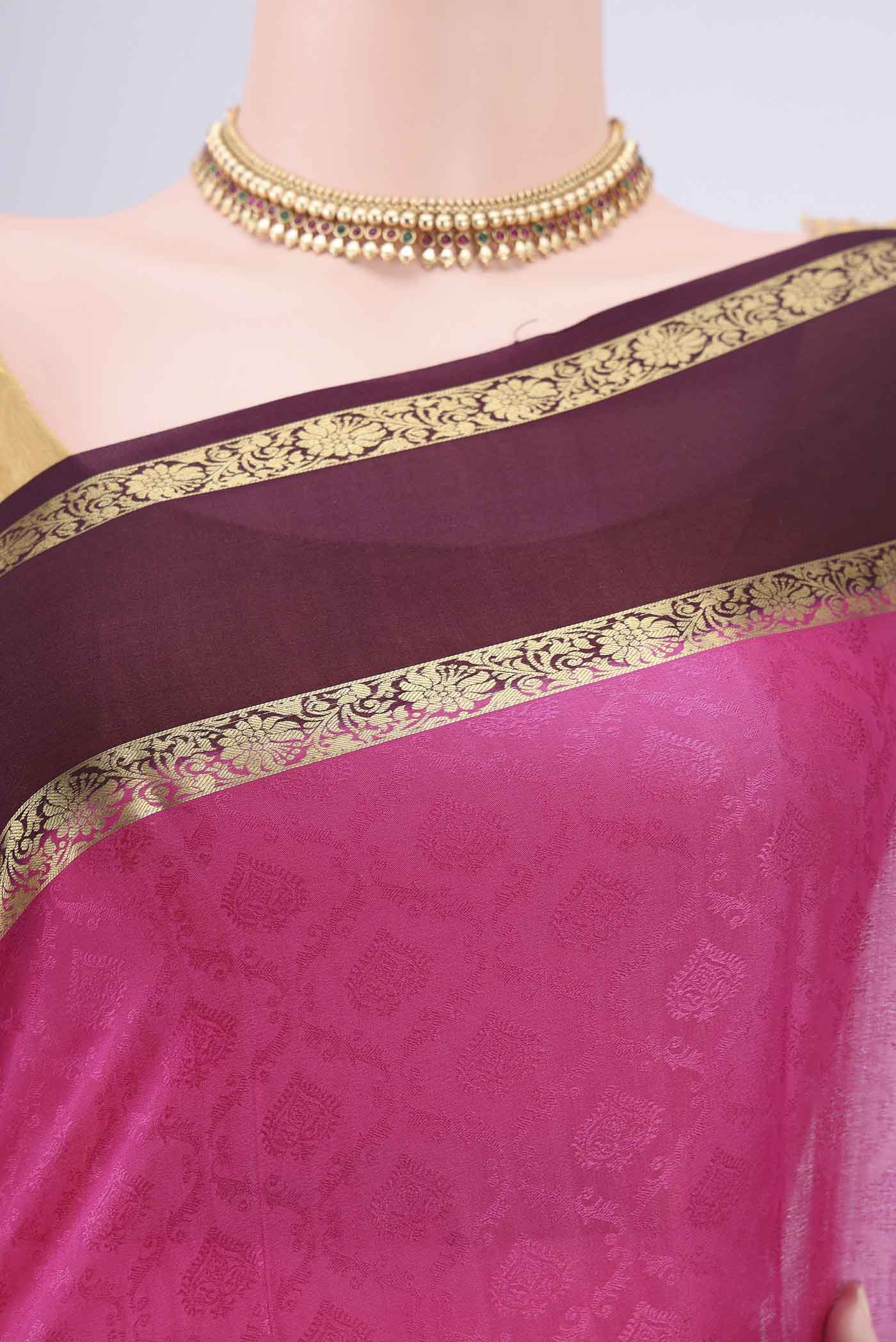 Border image of Rani Pink Mysore Crepe Saree with Jacquard design on the body and Zari Border. 