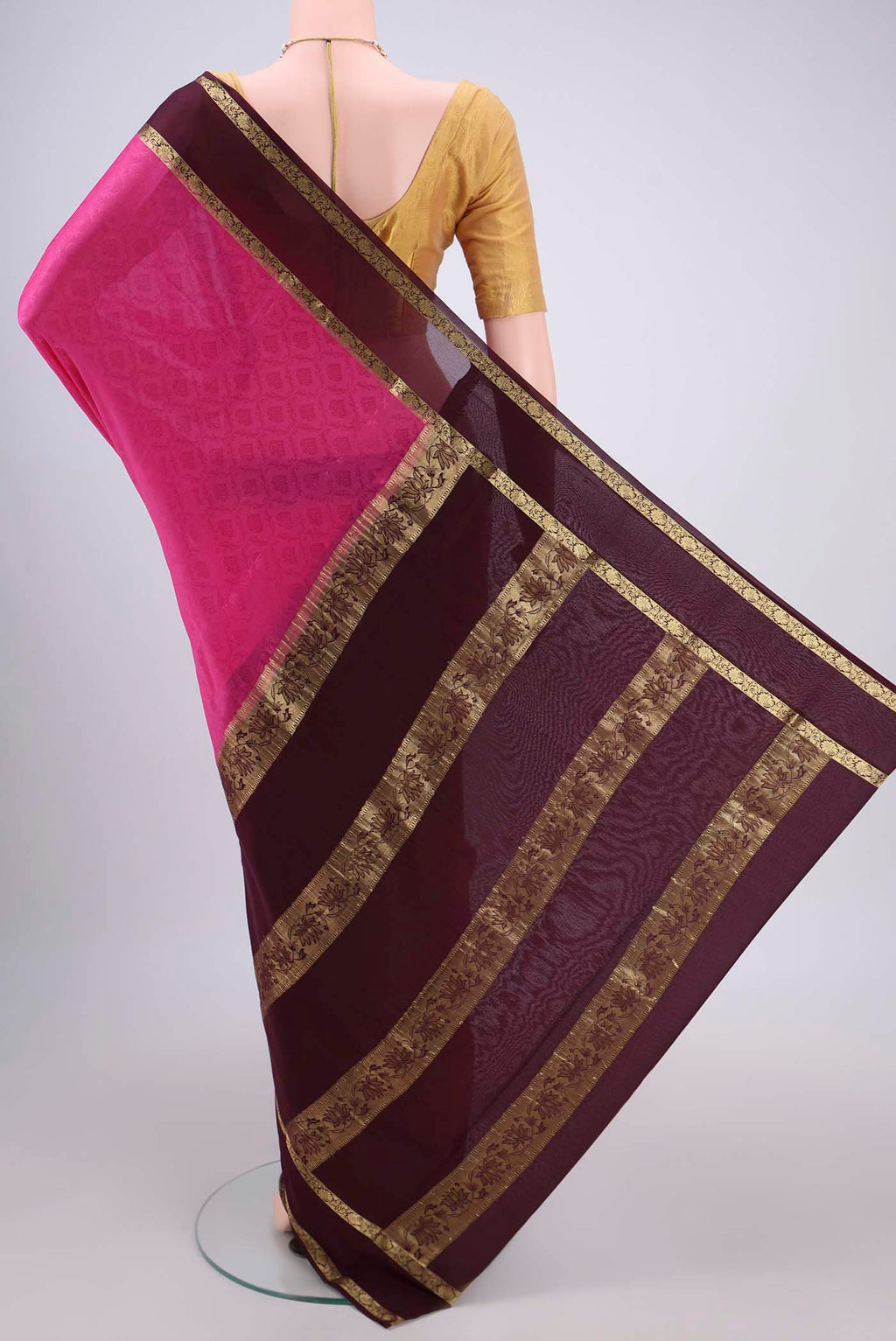 Flat view of Rani Pink Mysore Crepe Saree with Jacquard design on the body and Zari Border. 