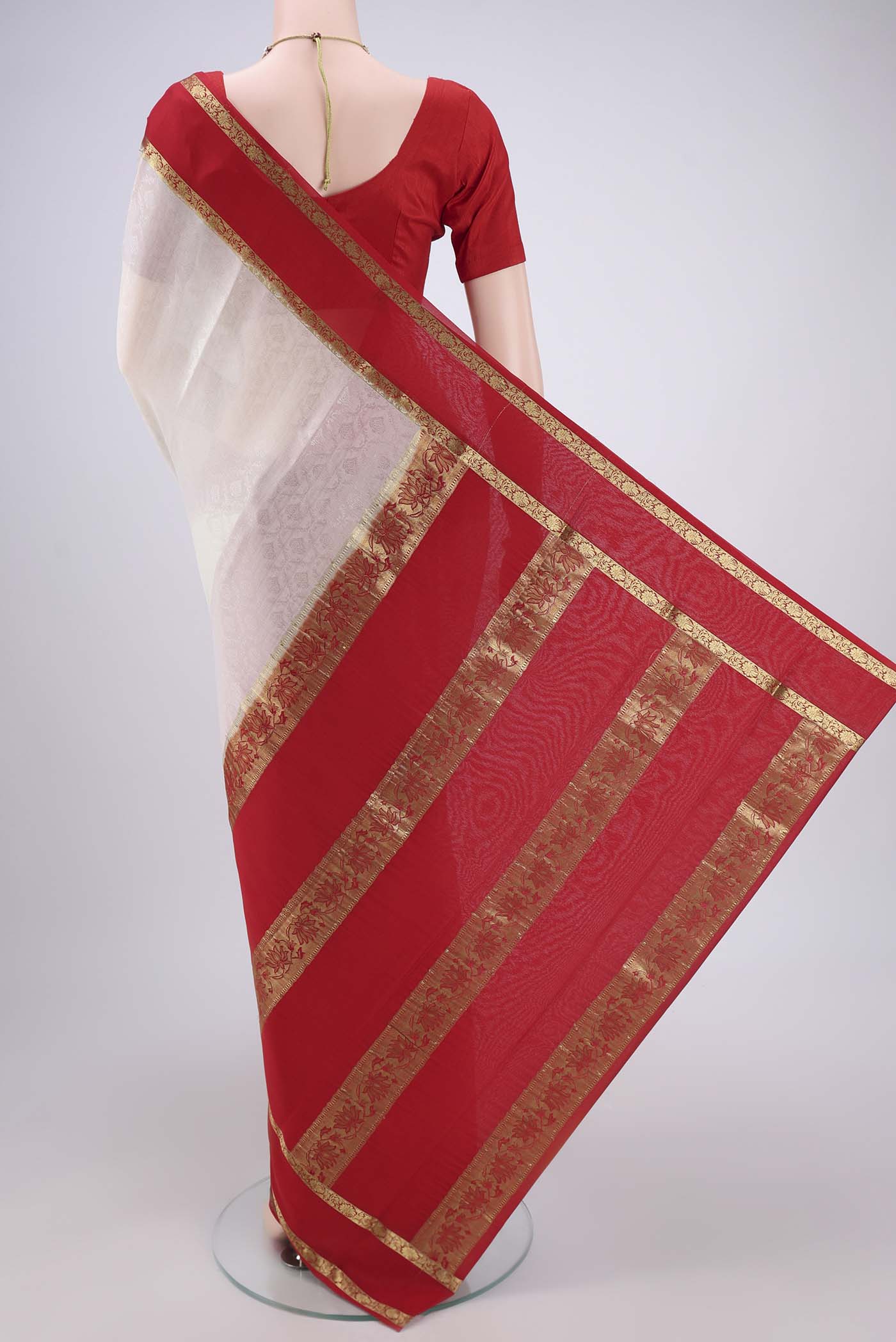 Flat view of Off White Mysore Crepe Saree with Jacquard design on the body and Zari Border. 