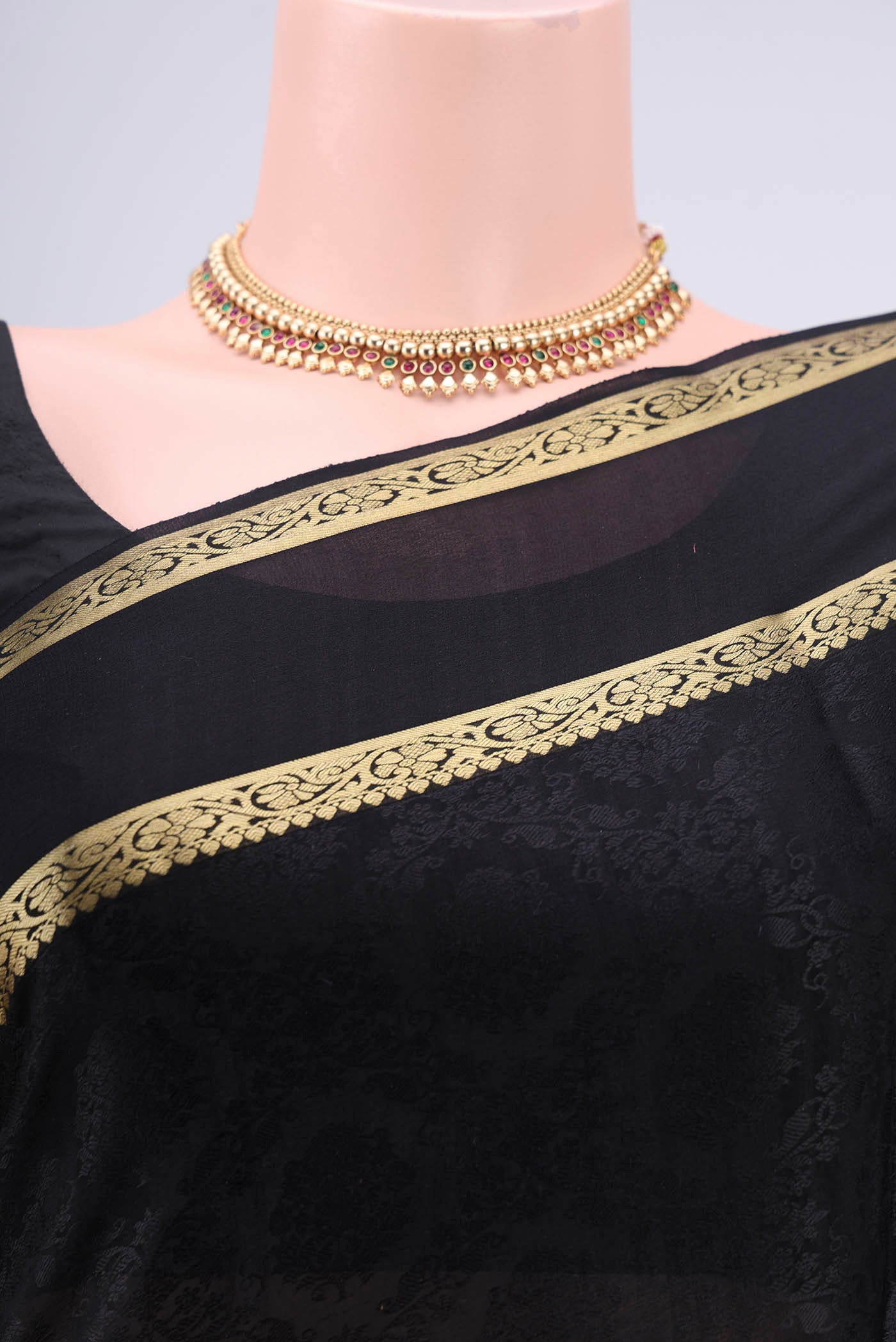 Border image of Black Mysore Crepe Saree with Jacquard design on the body and Zari Border. 