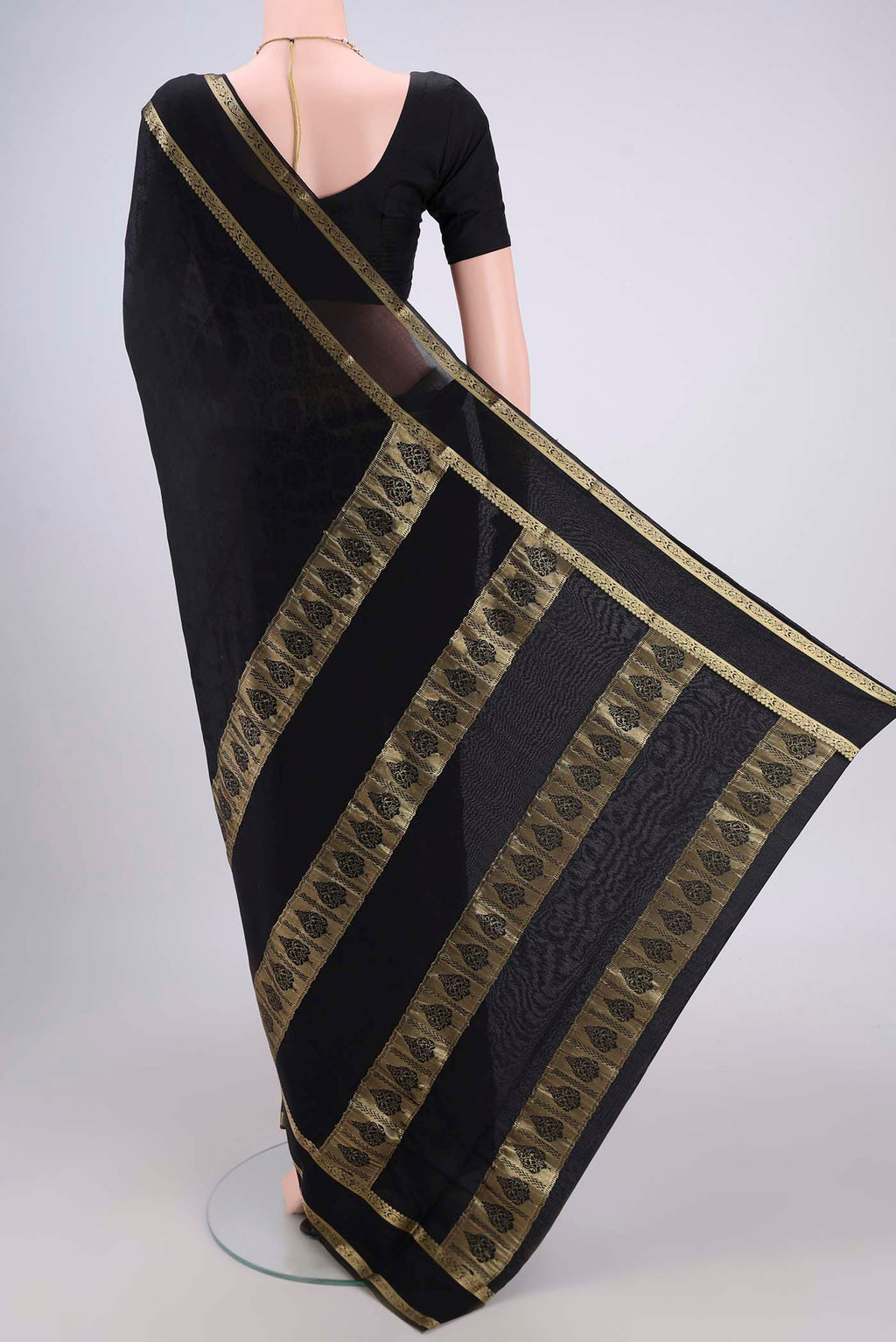 Flat view of Black Mysore Crepe Saree with Jacquard design on the body and Zari Border. 