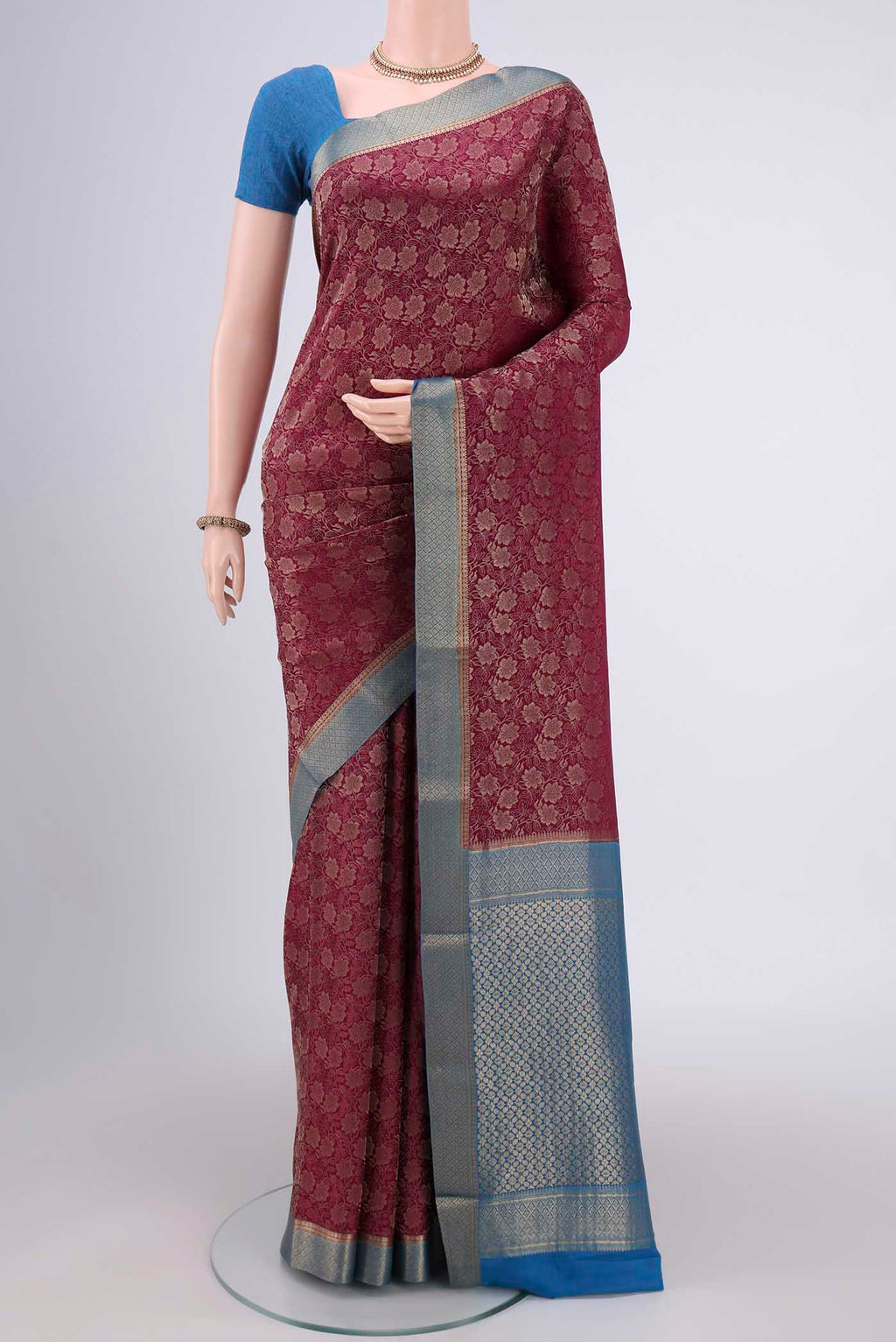 Magenta Mysore Crepe Saree with Zari Brocade on the body and Zari Border.  displayed on a mannequin