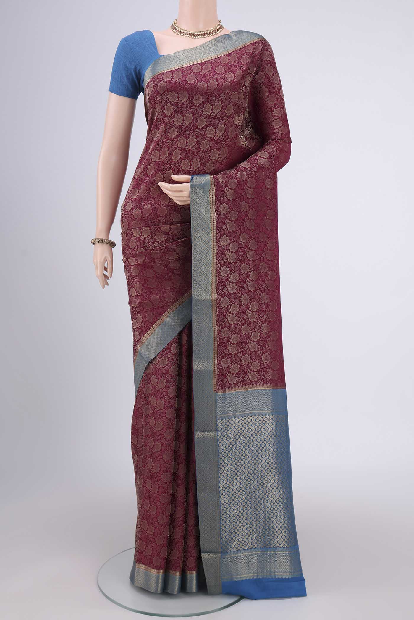 Magenta Mysore Crepe Saree with Zari Brocade on the body and Zari Border.  displayed on a mannequin