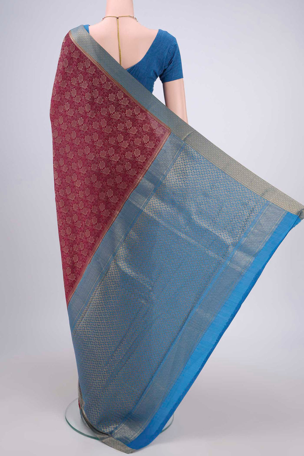 Flat view of Magenta Mysore Crepe Saree with Zari Brocade on the body and Zari Border. 