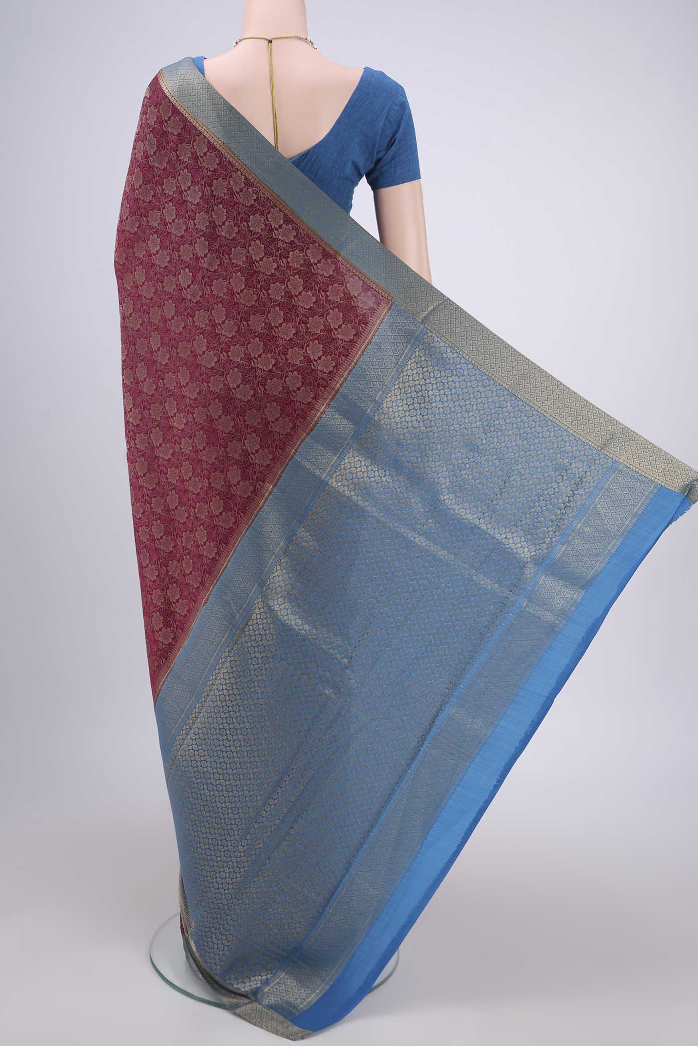 Flat view of Magenta Mysore Crepe Saree with Zari Brocade on the body and Zari Border. 