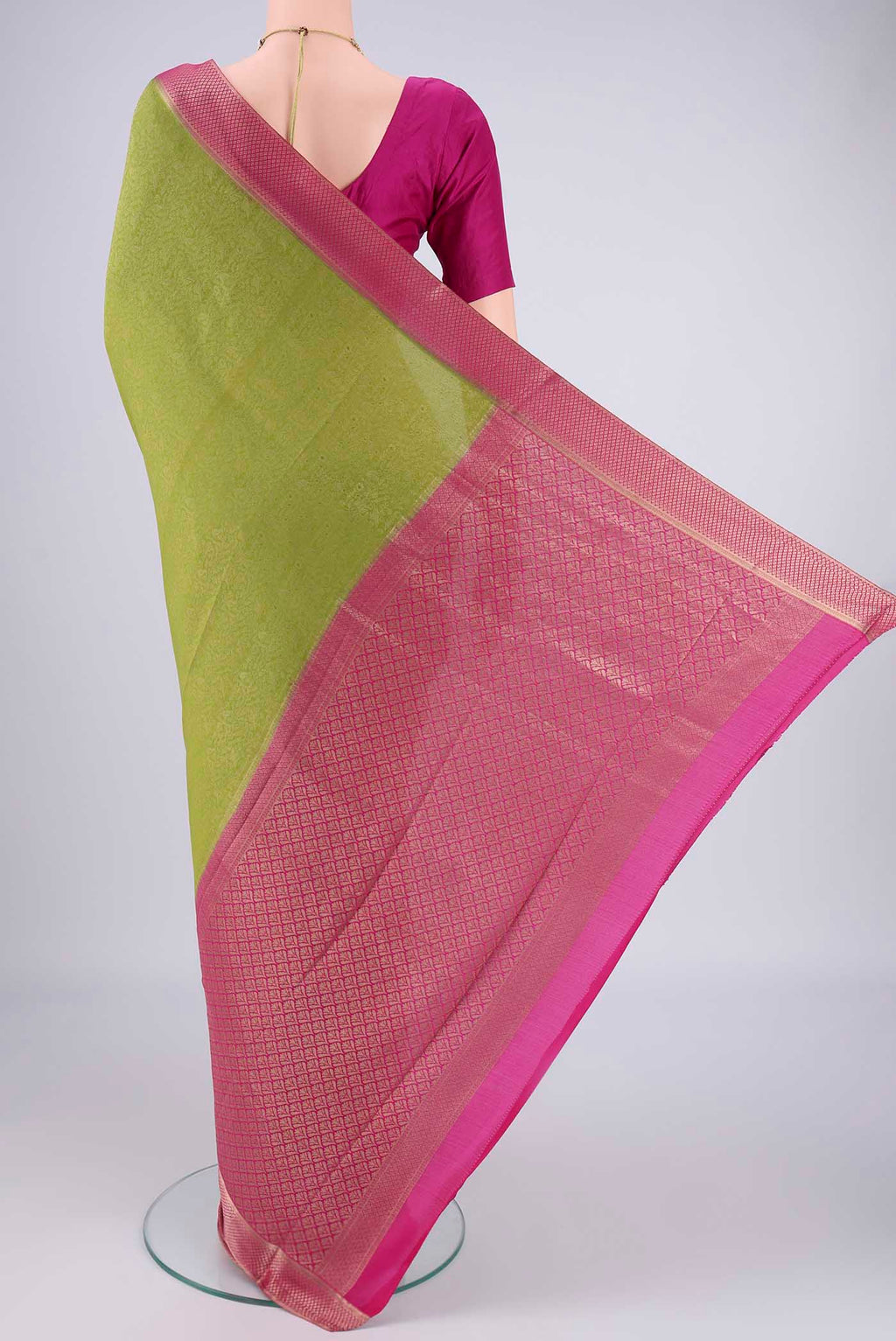 Flat view of Green Mysore Crepe Saree with Zari Brocade on the body and Zari Border. 