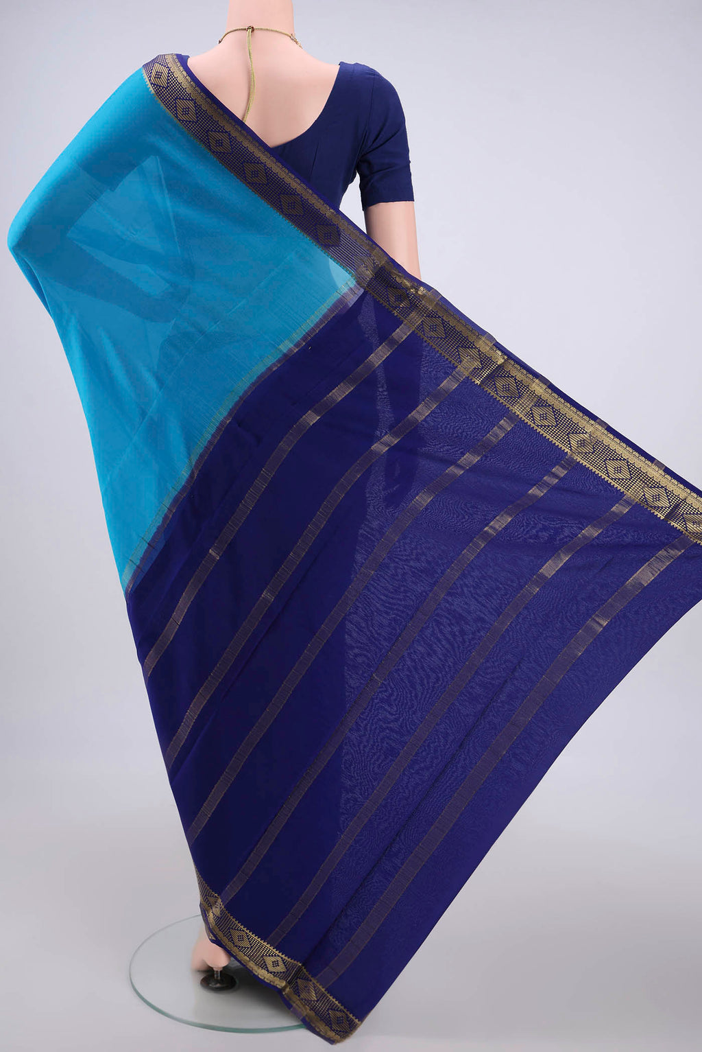 Flat view of Electric Blue Mysore Crepe Saree with Plain Body and Zari Border. 