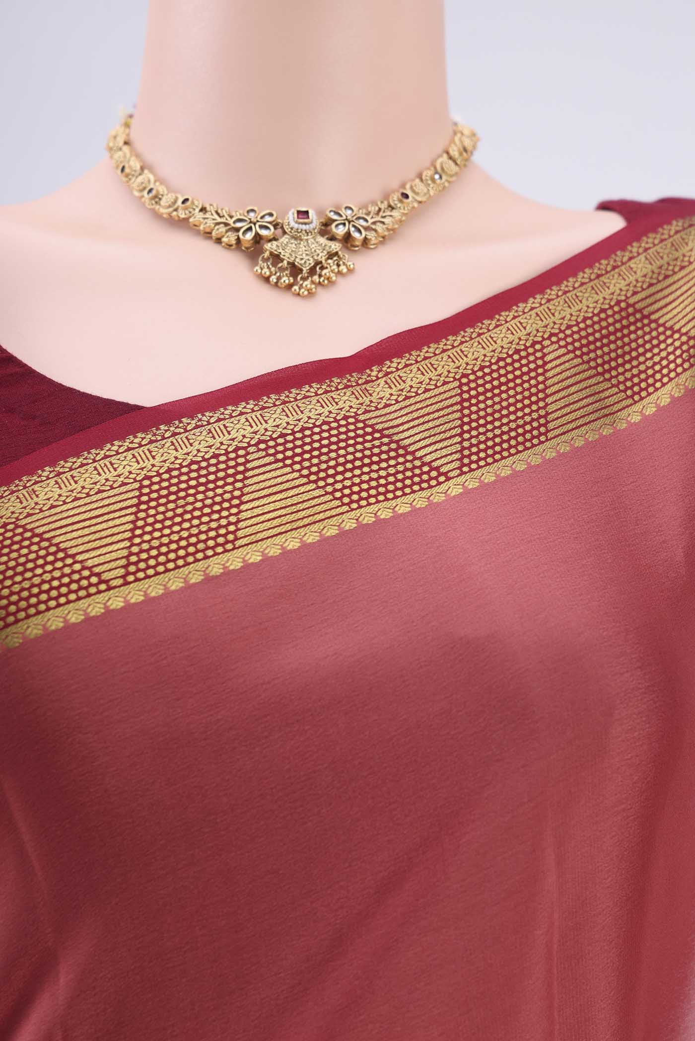 Border image of Coral Mysore Crepe Saree with Plain Body and Zari Border. 