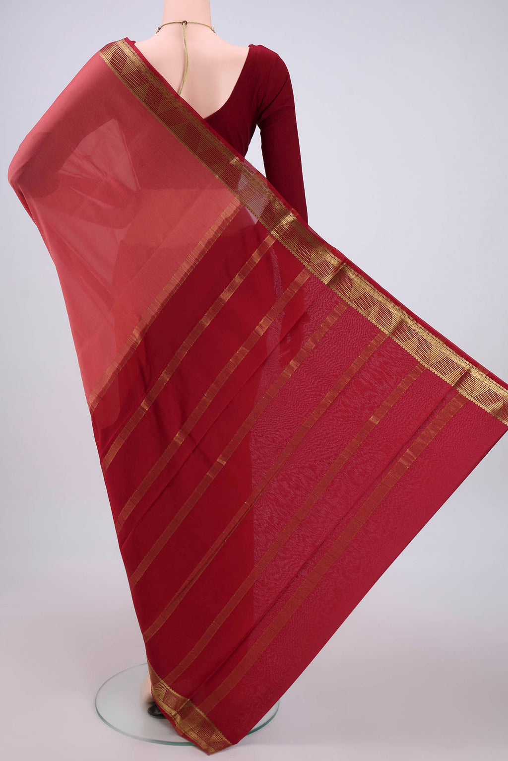 Flat view of Coral Mysore Crepe Saree with Plain Body and Zari Border. 