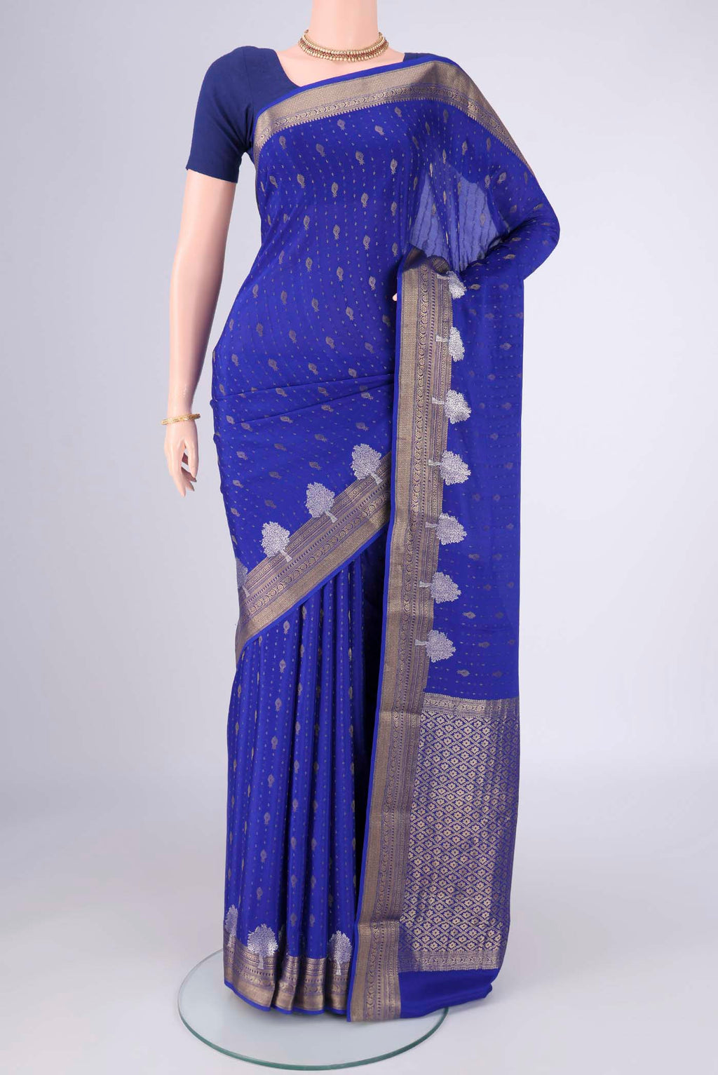 Royal Blue Mysore Crepe Saree with Zari Butta on the body and Zari Border.  displayed on a mannequin