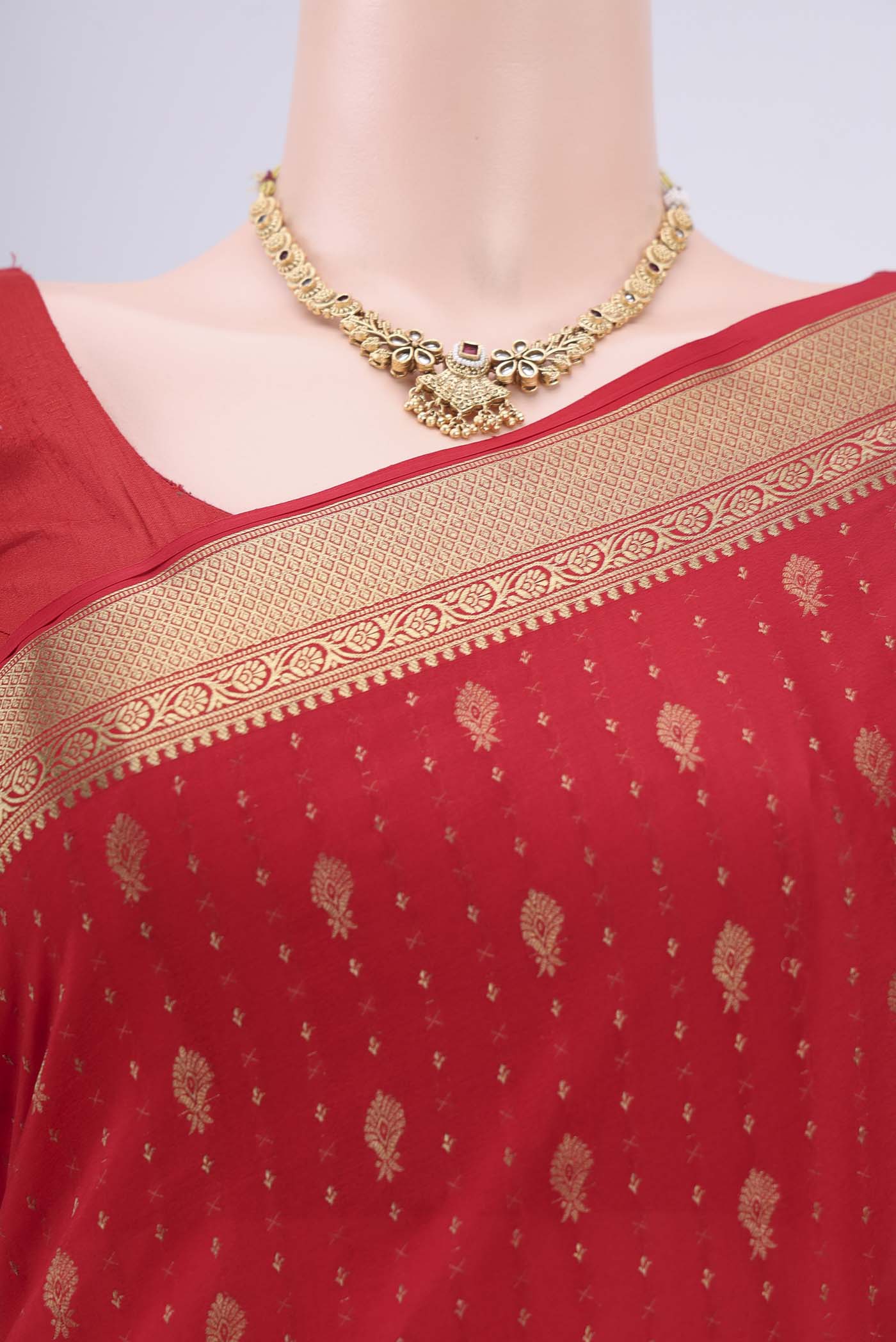 Border image of Red Mysore Crepe Saree with Zari Butta on the body and Zari Border. 