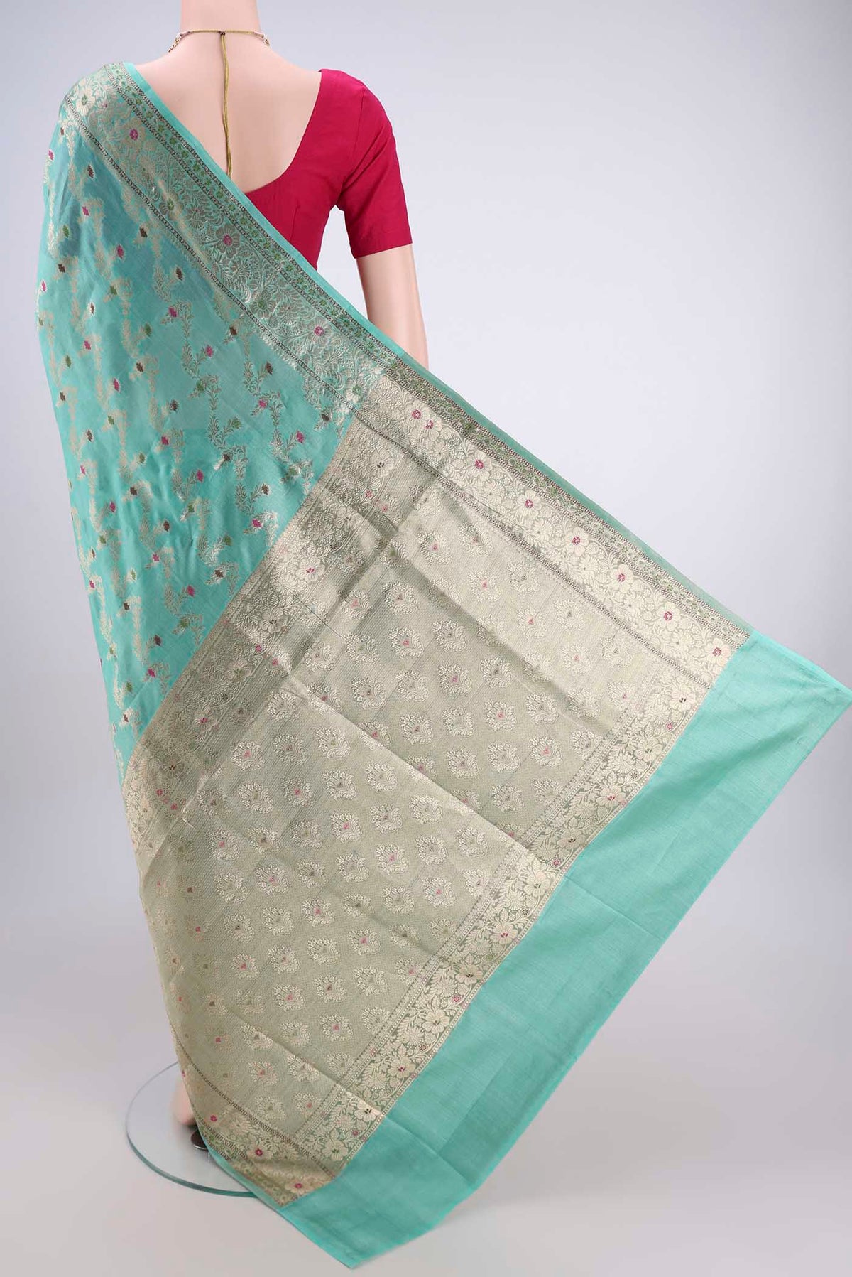 Flat view of Mint Green Banarasi Tussar Silk Saree with Zari And Thread Butta on the body and Zari And Thread Border. 