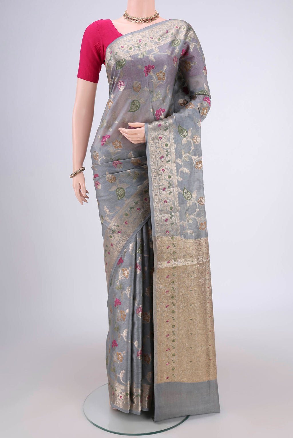 Grey Banarasi Tussar Silk Saree with Zari And Thread Butta on the body and Zari And Thread Border.  displayed on a mannequin