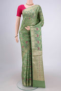 Light Green Banarasi Tussar Silk Saree with Zari Brocade on the body and Zari And Thread Border.  displayed on a mannequin