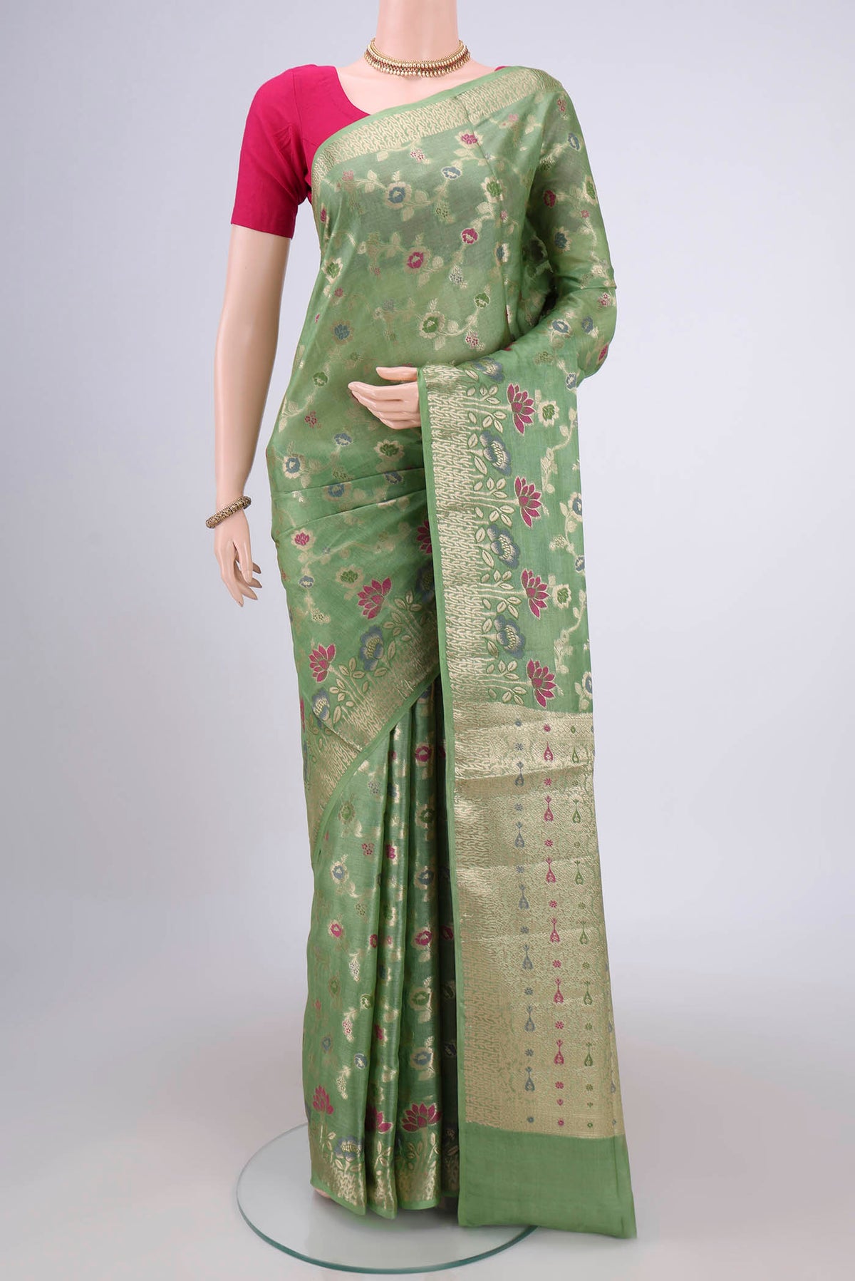 Light Green Banarasi Tussar Silk Saree with Zari Brocade on the body and Zari And Thread Border.  displayed on a mannequin