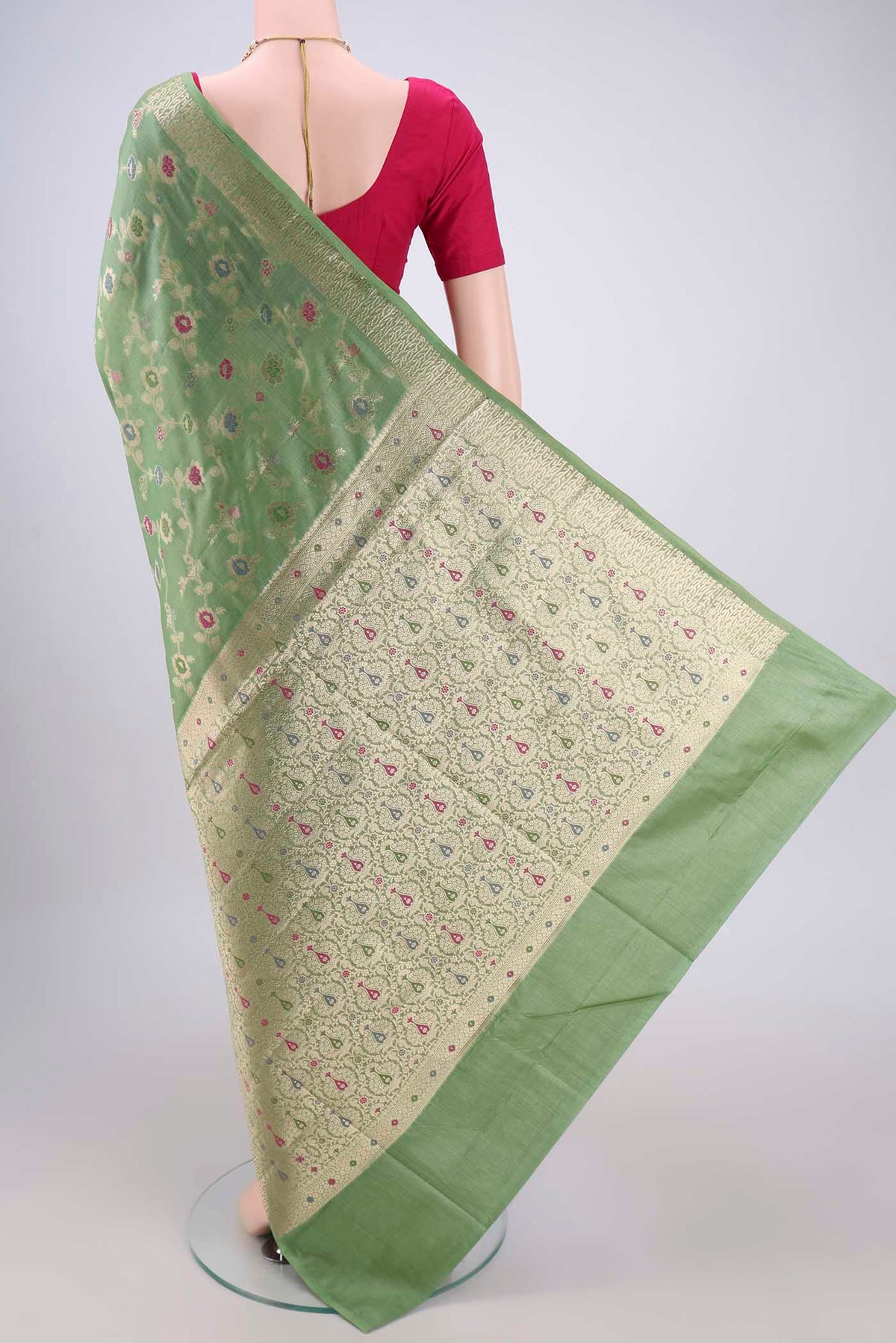 Flat view of Light Green Banarasi Tussar Silk Saree with Zari Brocade on the body and Zari And Thread Border. 