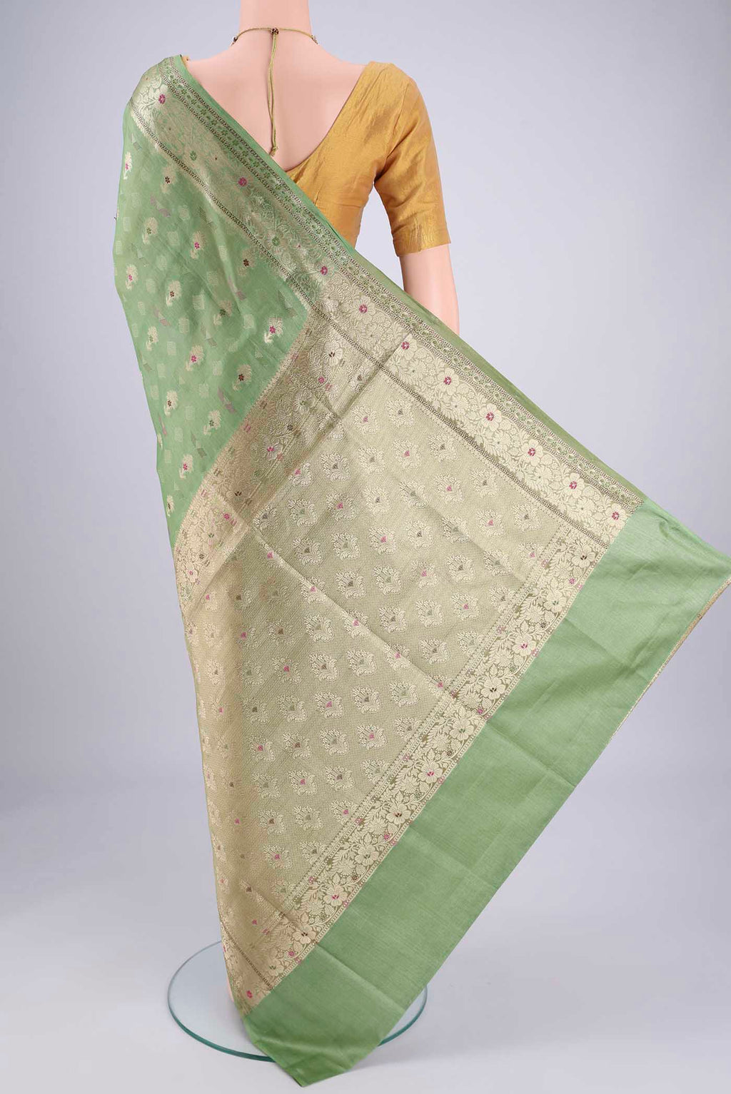 Flat view of Light Green Banarasi Tussar Silk Saree with Zari And Thread Butta on the body and Zari And Thread Border. 
