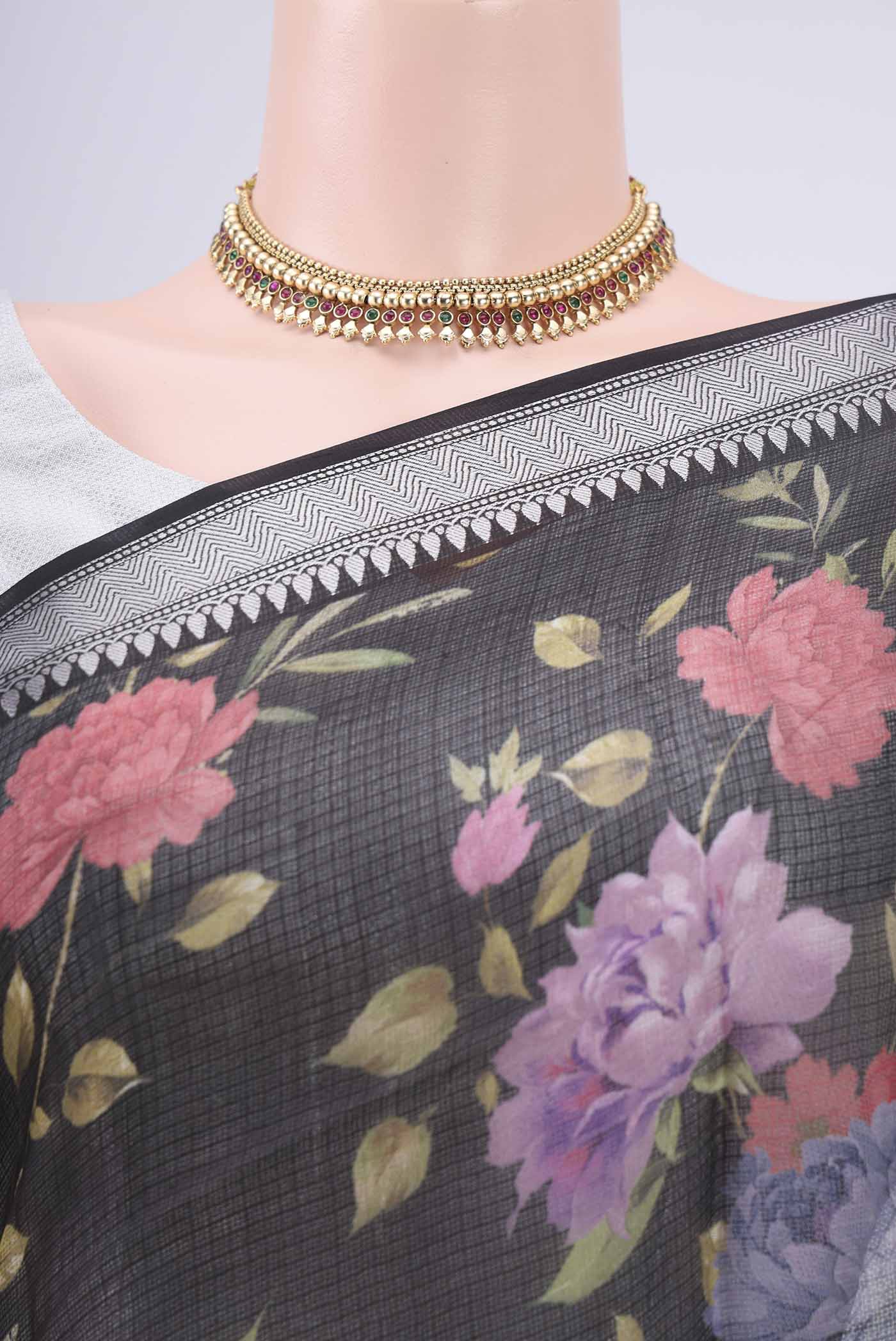 Border image of Black Kota Silk Saree with Floral Print on the body and Zari Border. 
