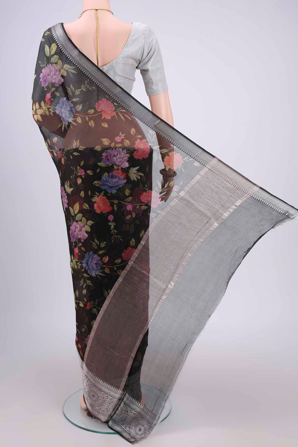 Flat view of Black Kota Silk Saree with Floral Print on the body and Zari Border. 