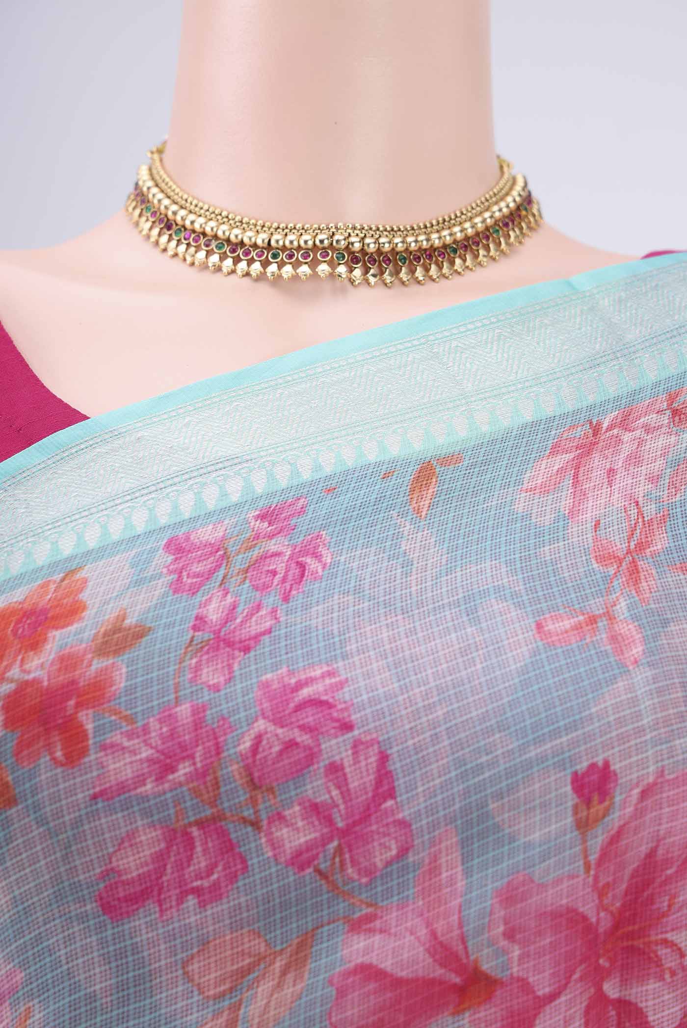 Border image of Turquoise Kota Silk Saree with Floral Print on the body and Zari Border. 