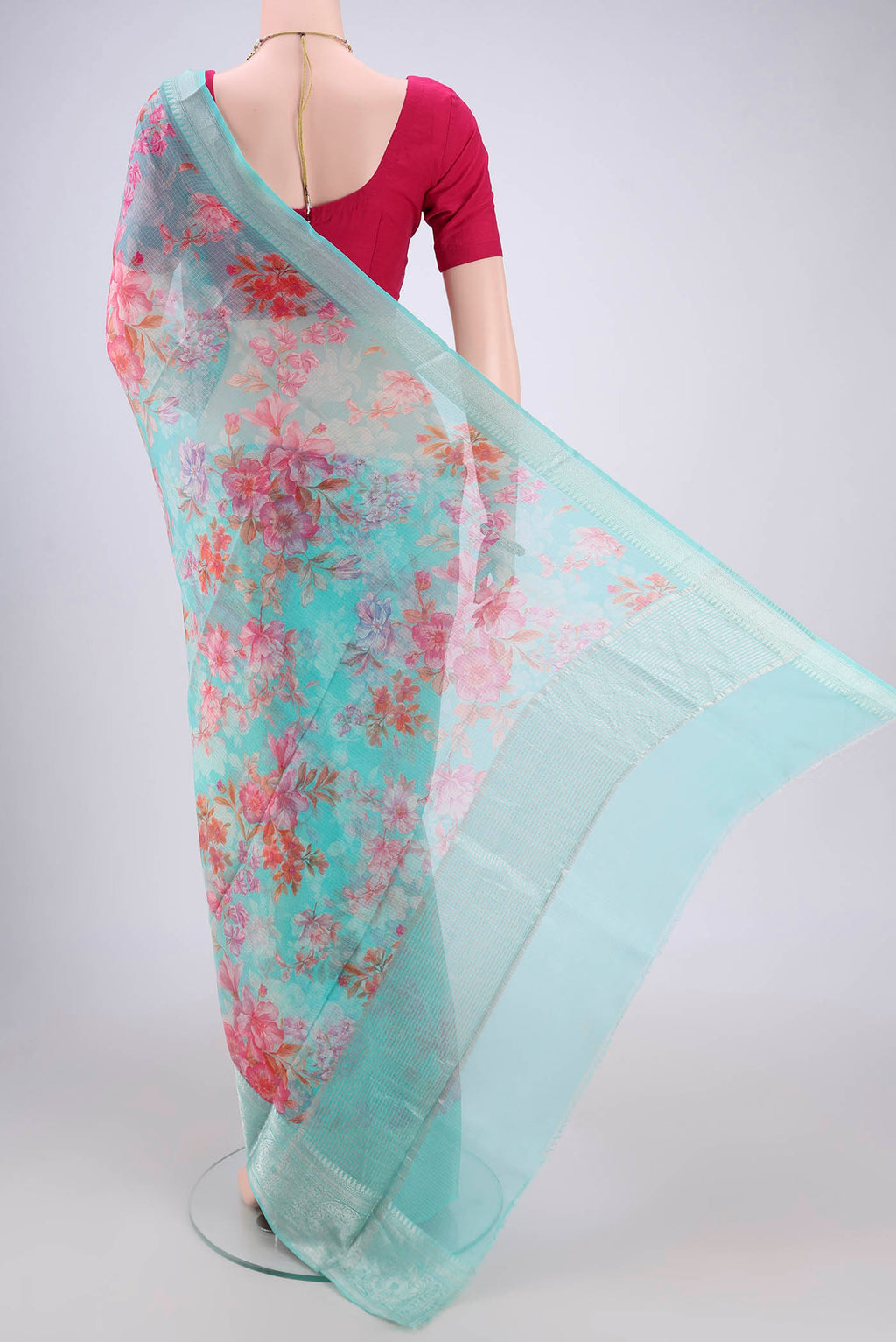 Flat view of Turquoise Kota Silk Saree with Floral Print on the body and Zari Border. 