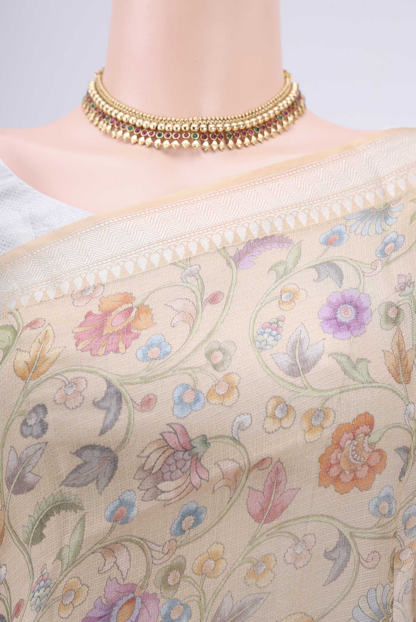 Border image of Beige Kota Silk Saree with Floral Print on the body and Zari Border. 