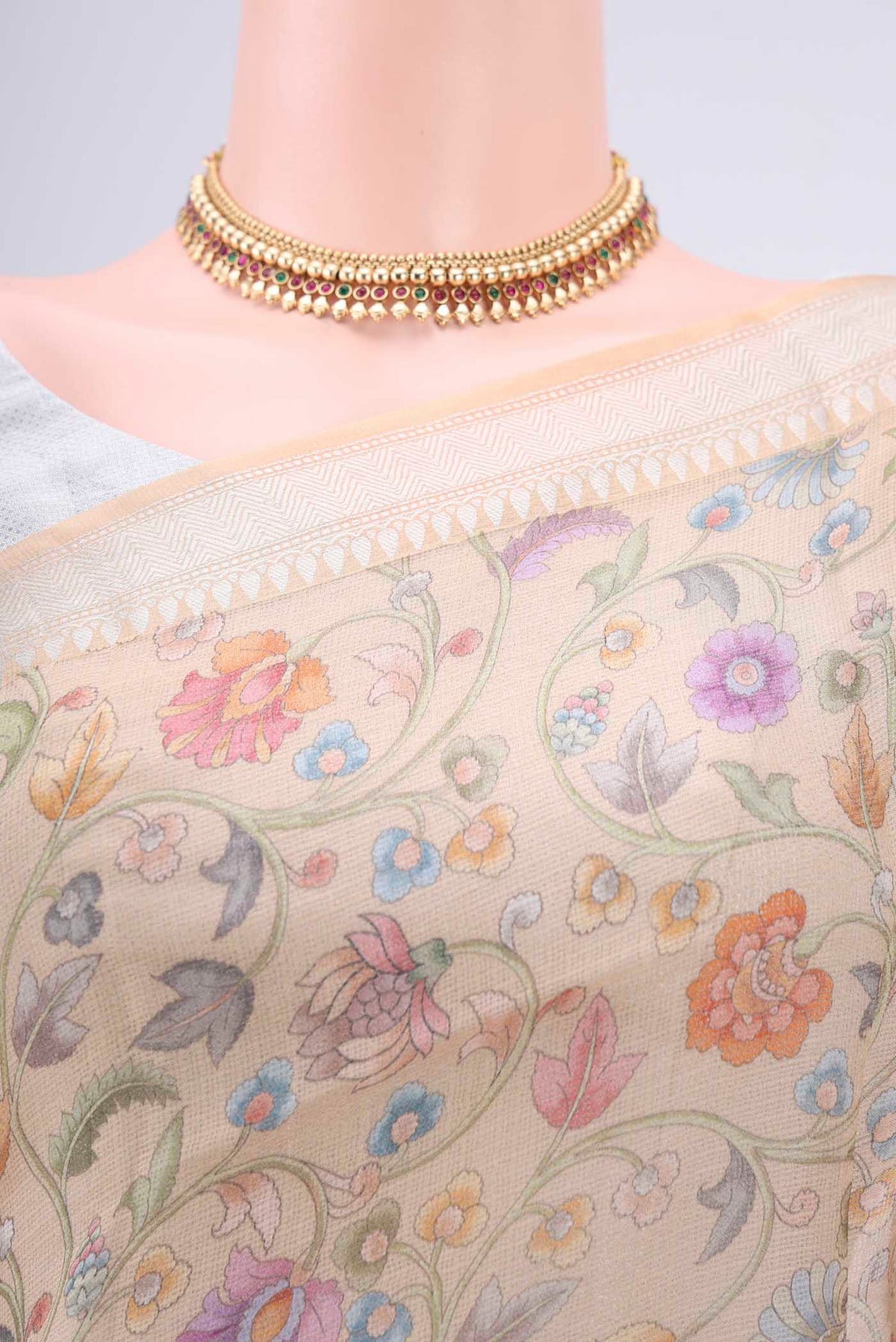 Border image of Beige Kota Silk Saree with Floral Print on the body and Zari Border. 
