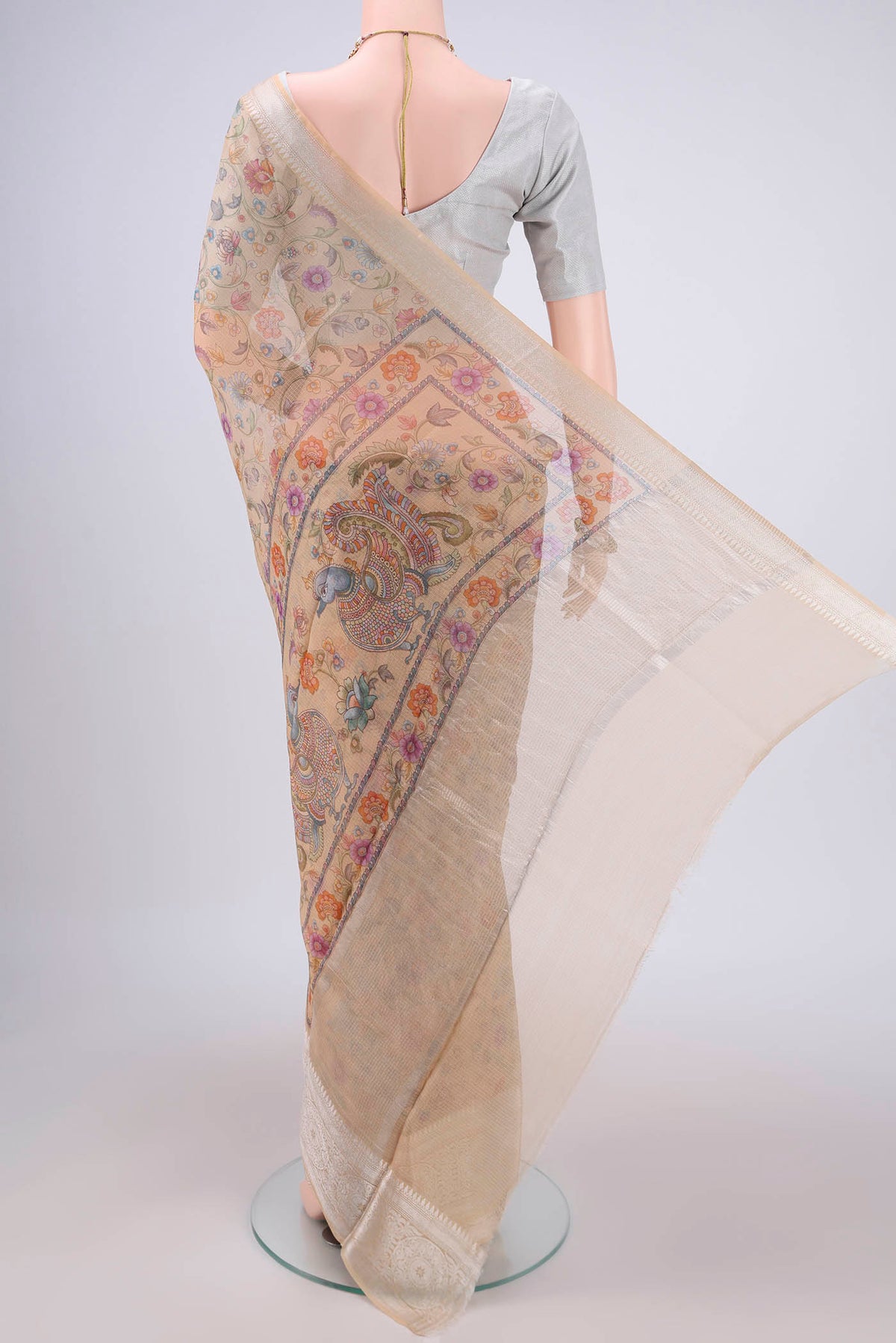 Flat view of Beige Kota Silk Saree with Floral Print on the body and Zari Border. 